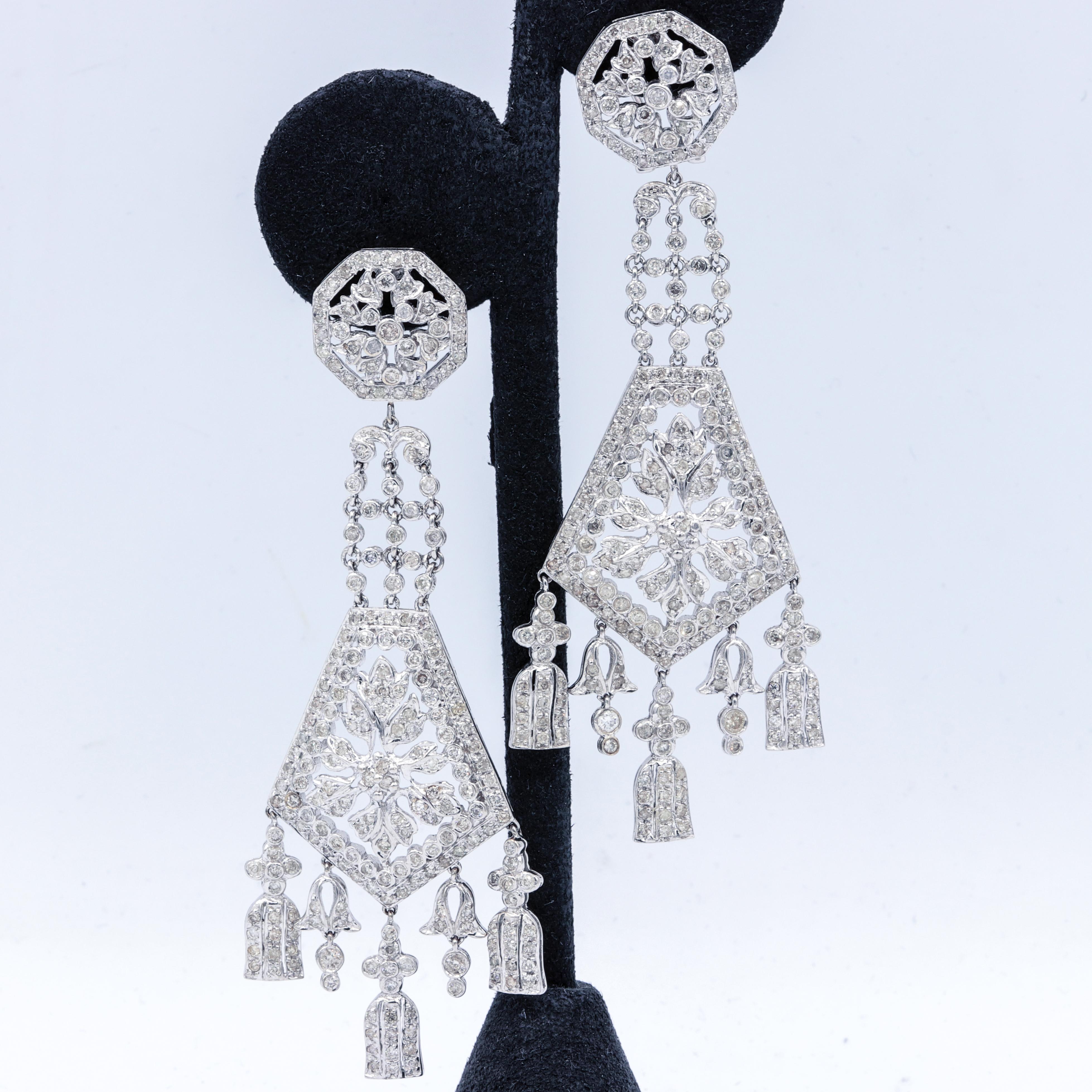 The Art Deco Edge.
14K White gold deco long chandelier earrings, features 7.00 ct round diamonds