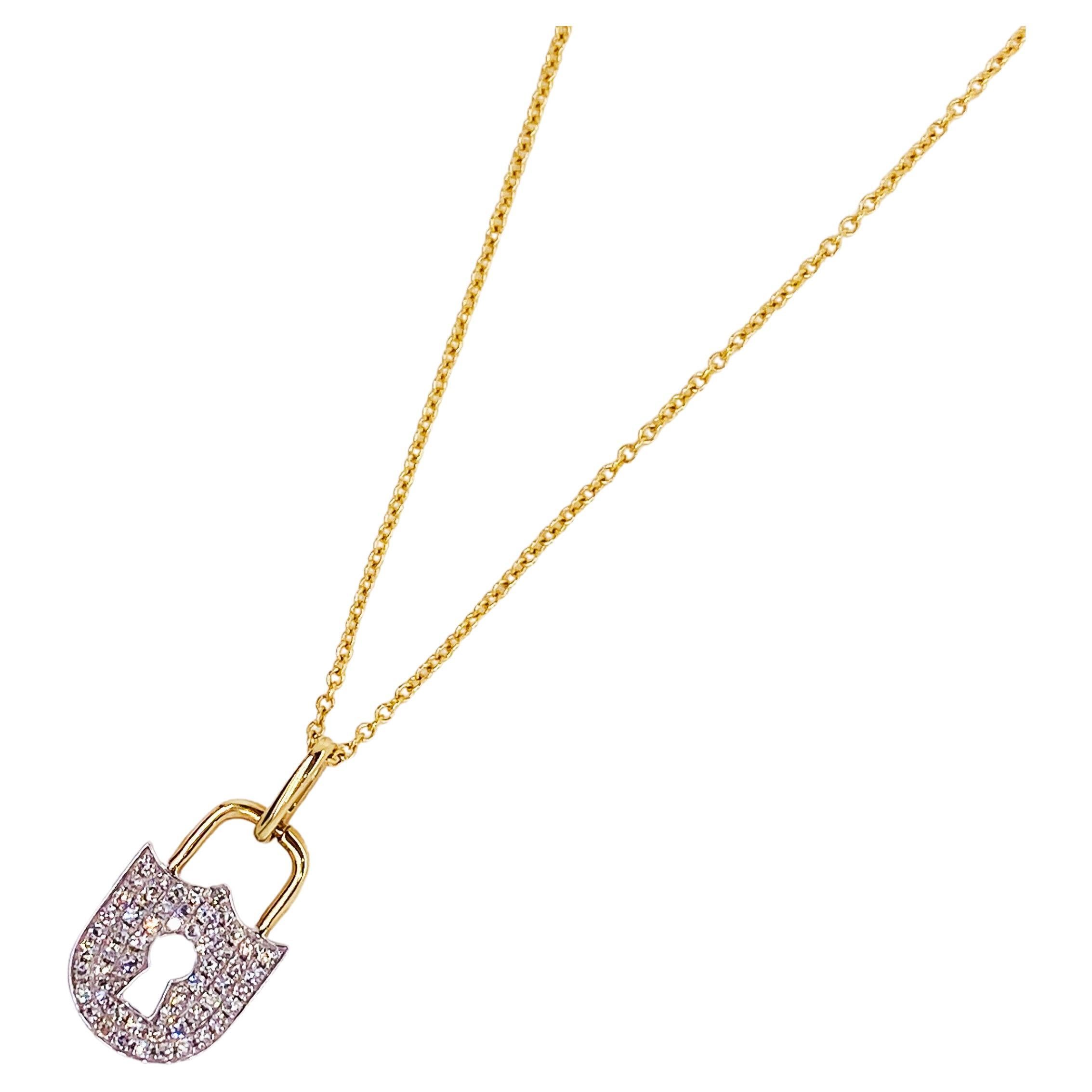 Your love is locked in this diamond lock necklace. The 57 diamonds are pave set on the 14 karat yellow gold lock pendant and has an 18 inch cable chain also constructed of solid 14 karat yellow gold. The love lock is a tradition where a couple seal