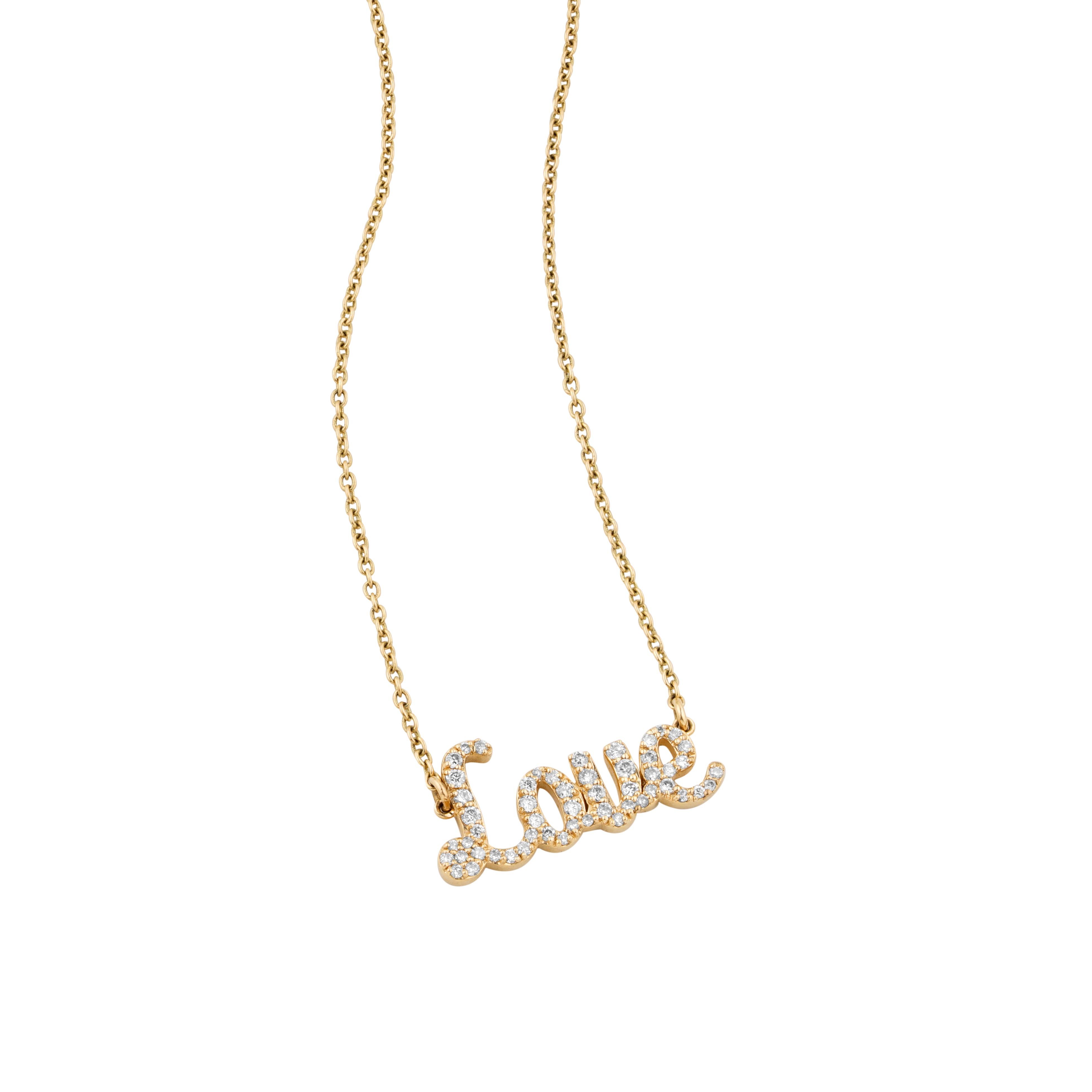 The Diamond Love Pendant Necklace
This enchanting 'Love' pendant necklace, graced with a golden sheen and encrusted with scintillating diamonds, is a true representation of timeless romance. The cursive elegance of the word 'Love' is brought to life