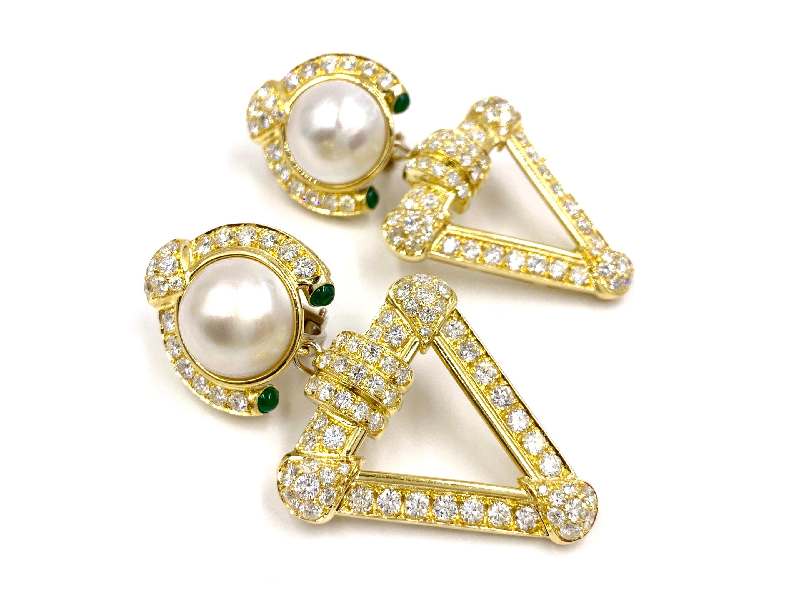 Simply exquisite Italian made 18 karat yellow gold earrings with versatility. These modern earrings can be worn as a button style earring or with the triangular diamond drop for a generous amount of sparkle. Earrings feature 10.68 carats of high