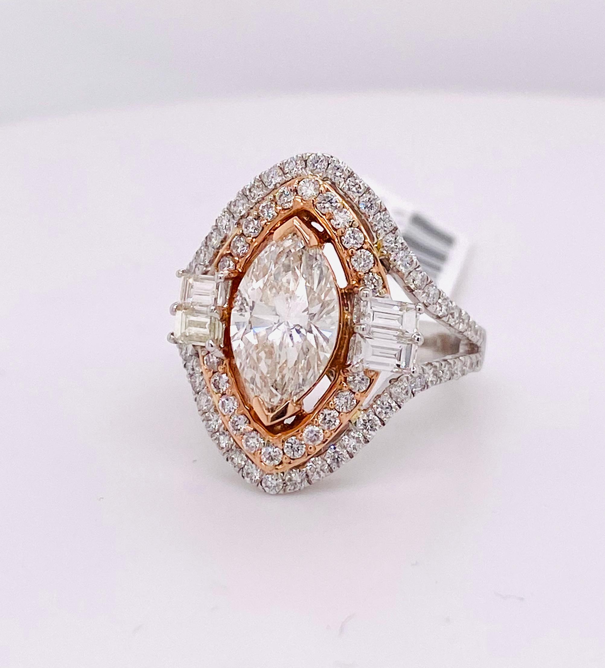 Diamond Marquise and Baguettes Split Shank Engagement Ring in 14K Two Tone RG/WG
Marquise: 2.04 / Dia: 0.939 / B: 0.643
Color: H/I / Clarity: SI
Size: 7 US
Weight: 7.1 Grams

One Of a Kind