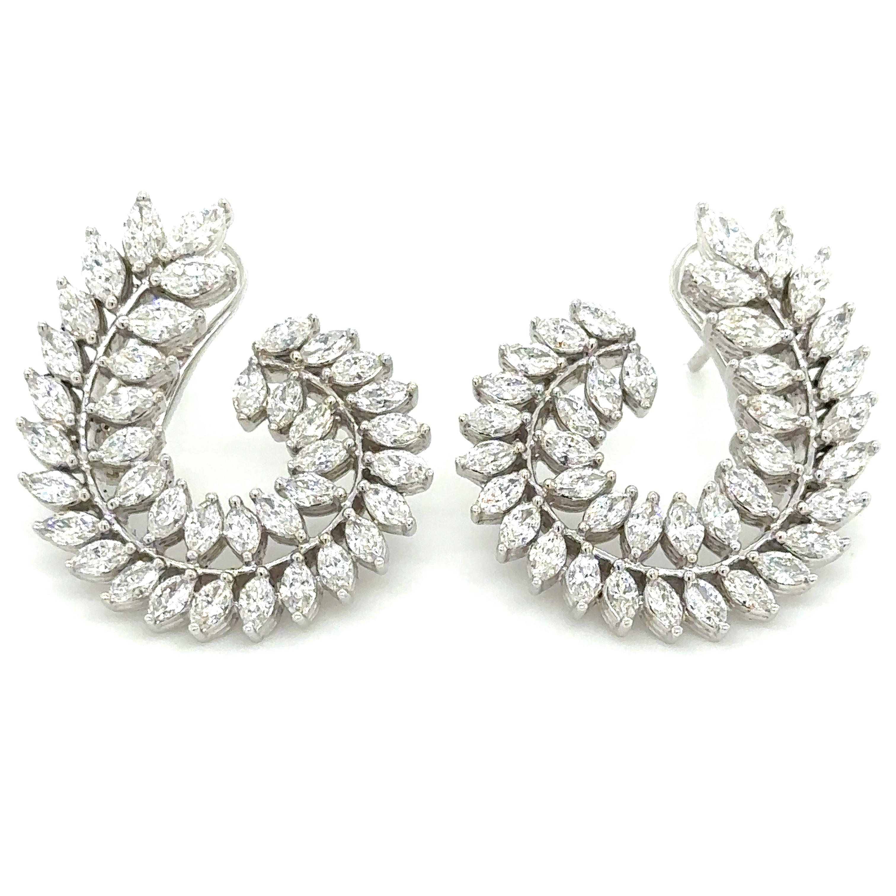 Adorn yourself lavishly with these exquisite statement earrings, crafted with 3.66carat total weight of striking marquise cut diamonds. Indulge in their magnetic shimmer and regal design to elevate any look and occasion into a truly luxurious