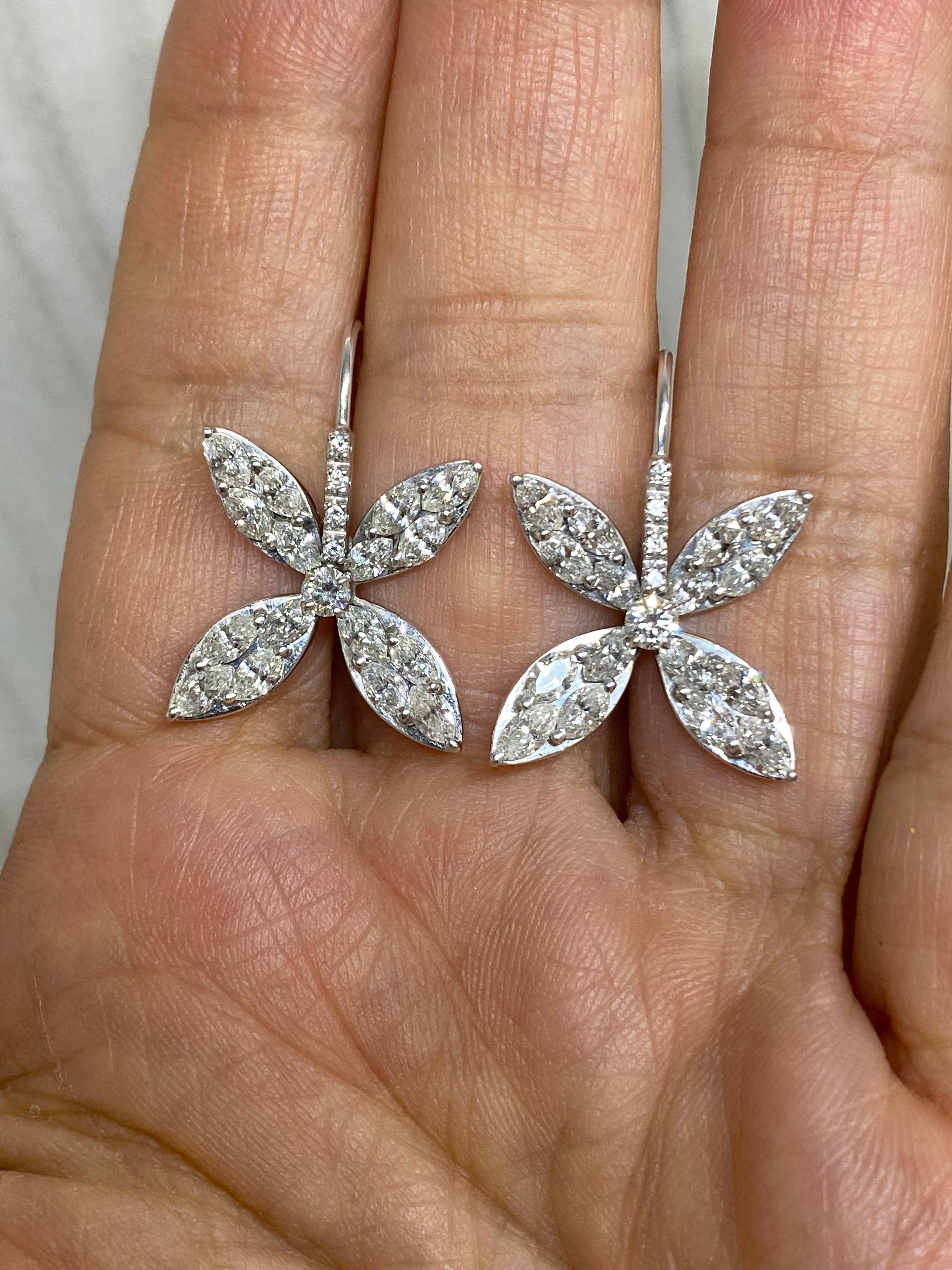 Perfect for everyday & dress up. Comfortable, Classic and dazzling. 
32 Marquise and 10 brilliant cut diamonds set in 18k white gold create these classic and elegant petal design. Perfect for day to night.
Approx. 3.4 CTW
G-H, VS-VS2
5/8 inch long