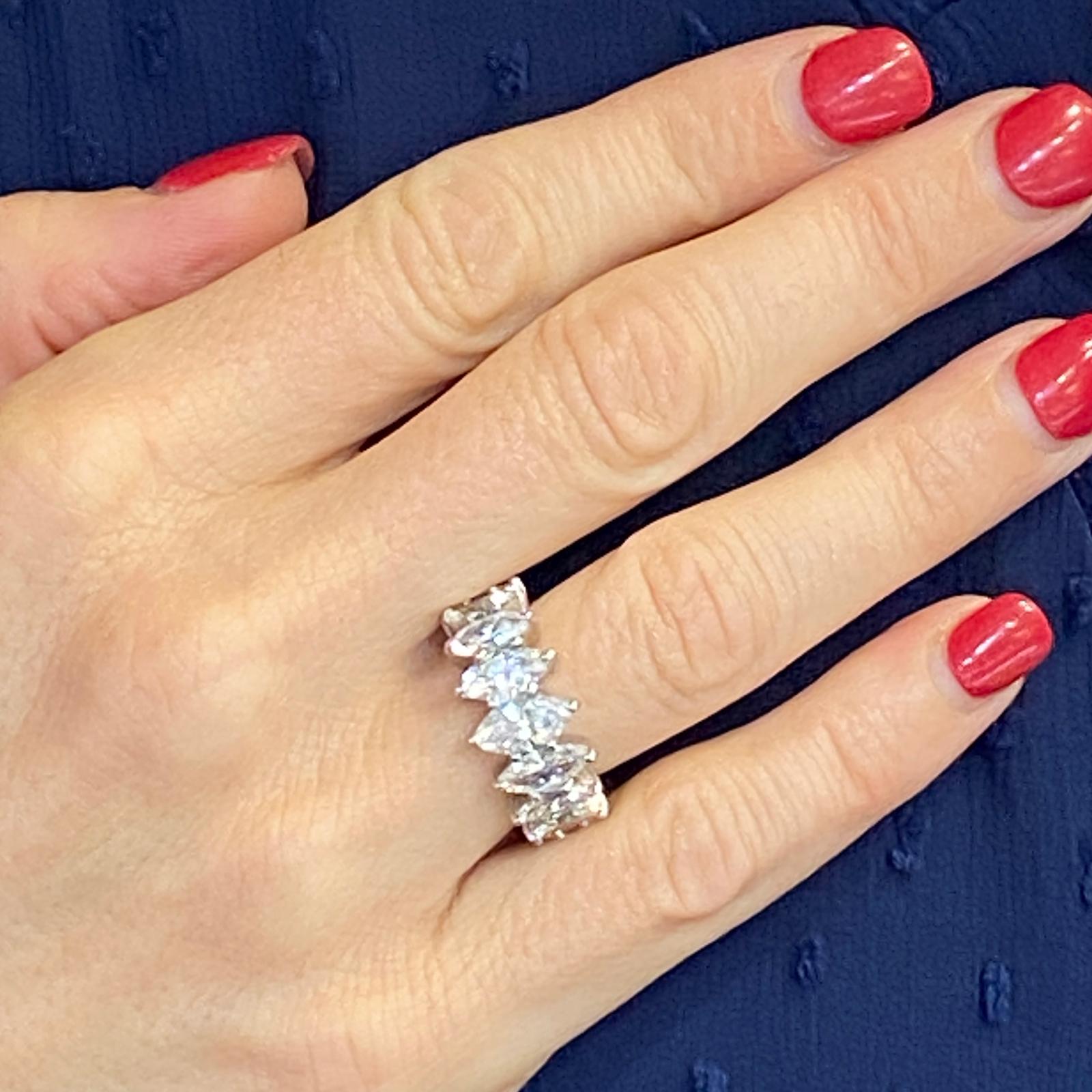 Stunning vintage marquise diamond platinum eternity band. The band is handcrafted and features 18 graduated marquise diamonds that equal approximately  5.50 carat total weight. The diamonds are all graded G-H color and VS-SI1 clarity. The ring is
