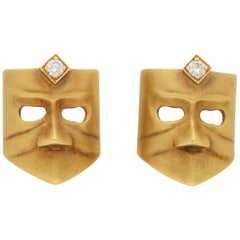 Orecchini a perno con diamante Masque in oro 18 carati