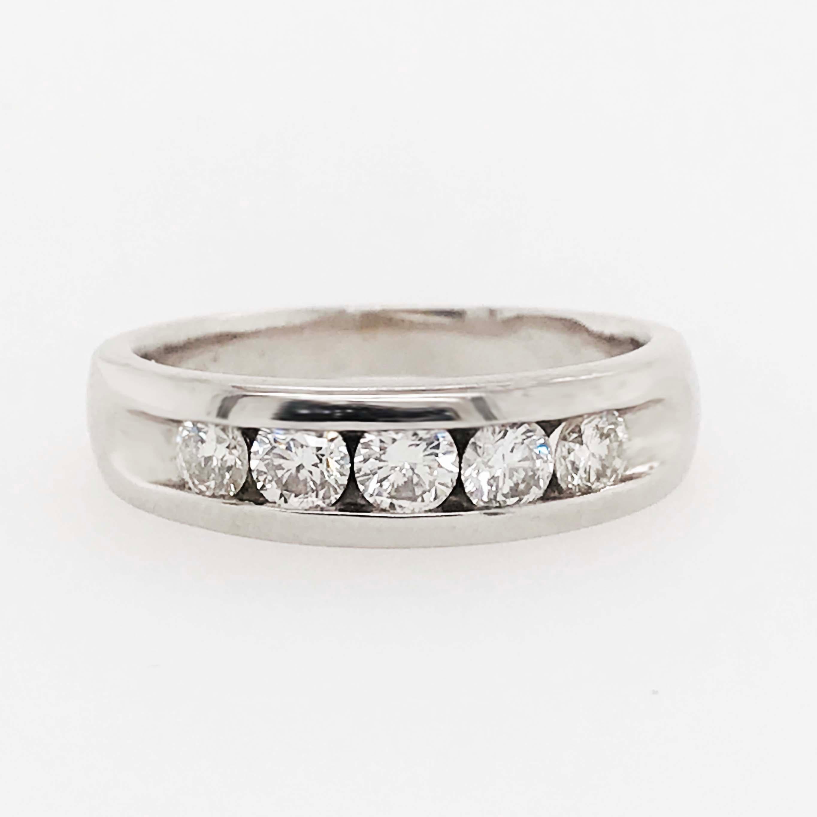 This diamond wedding band is classic and striking! With five round brilliant, natural diamonds set in a channel setting on the top of the ring. The men's diamond band is bold and timeless! The round brilliant diamonds are the perfect size to accents