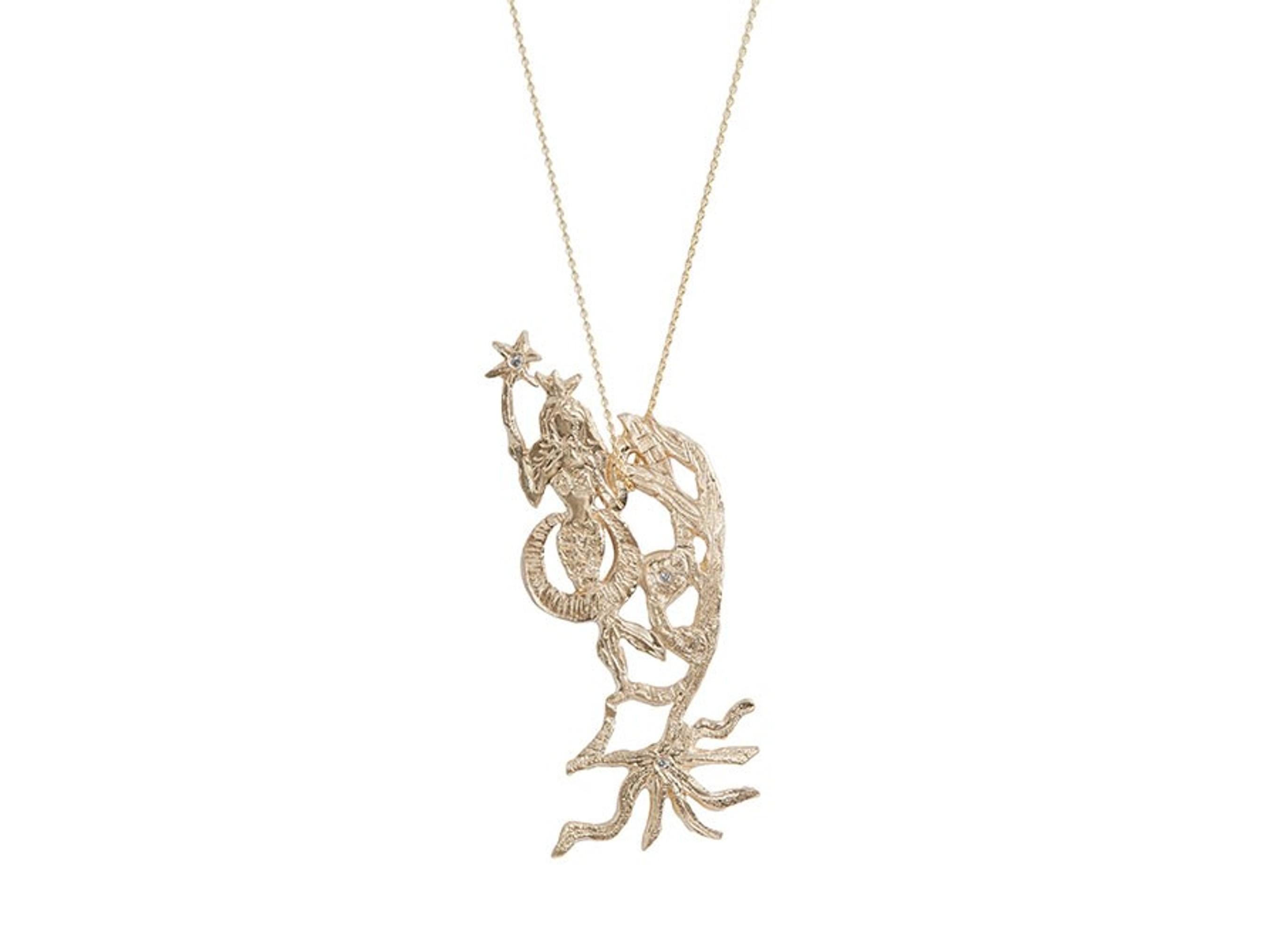 Absolutely gorgeous four diamond 14K yellow gold pendant necklace from Xiao Wang's Mermaid Collection. “This collection is inspired by the Japanese manga Mermaid Saga,” explains Wang. ”I wanted her to be magical, and so I placed a wand in her hand.