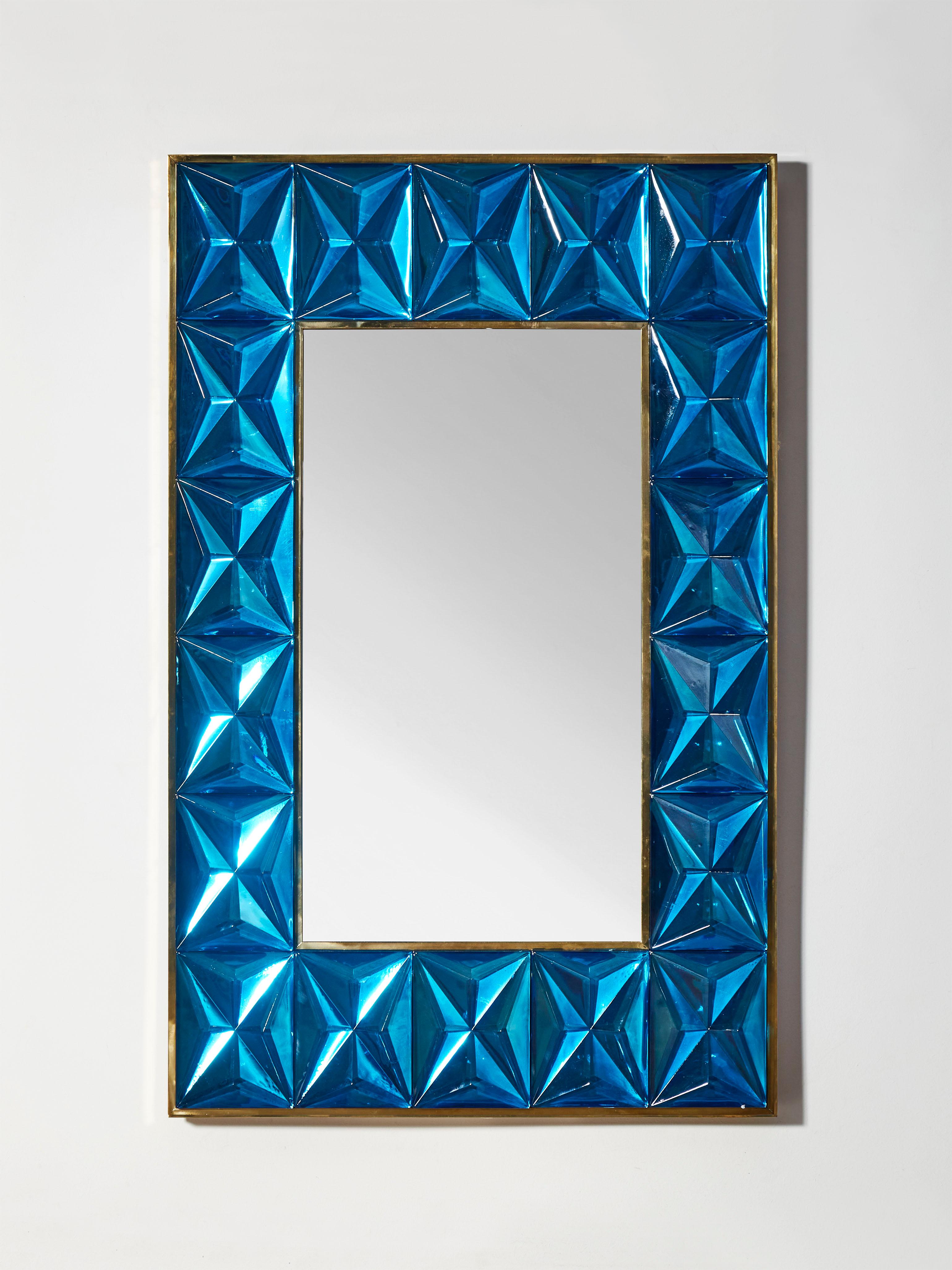 Mirror with frame made of brass and sculpted blue 