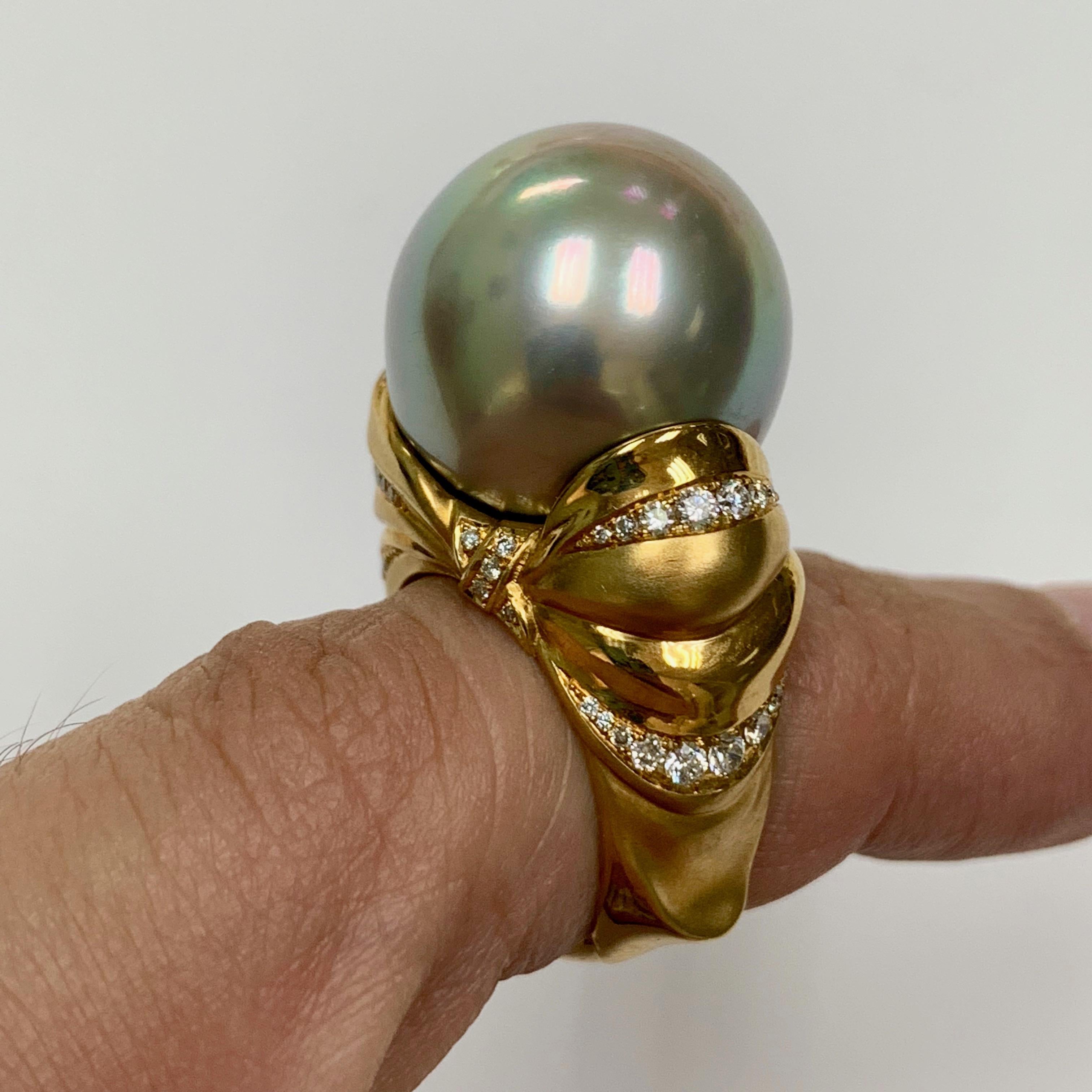 Diamond Mocca Color Tahiti Pearl 18 Karat Yellow Gold Bow Ring

Very rare combination of color and size of the Pearl. Unusual Mocca Color Tahiti Pearl with impressive size of 17mm. Do not miss the design of this masterpiece. Lush and weightless Bow