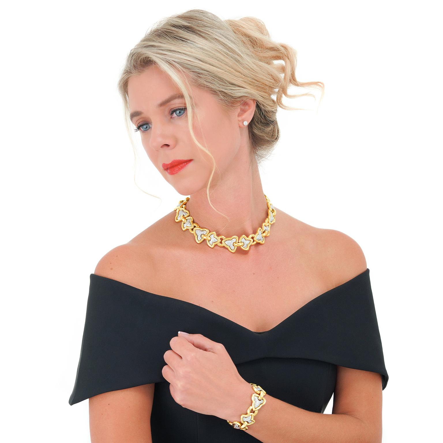 Circa 1970s, 18k, Italy.   Set with 14.50 carats of superb white diamonds (F color, VS clarity), this ivy motif necklace stylishly blends seventies Italian design with a classical foliate motif. The look is Milan fashion week meets the Tate Modern.