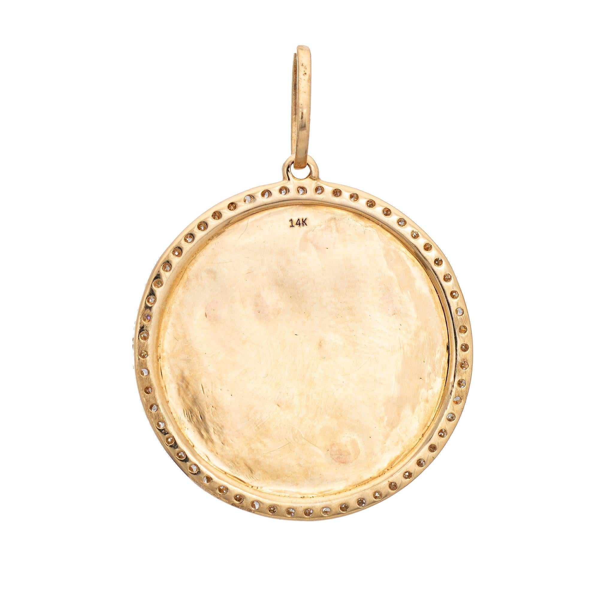 Finely detailed Moon, Star and Saturn celestial diamond pendant crafted in 14k yellow gold.  

Diamonds total an estimated 0.55 carats (estimated at H-I color and VS2-I1 clarity).

The unique charm highlights a celestial galaxy of stars, a crescent