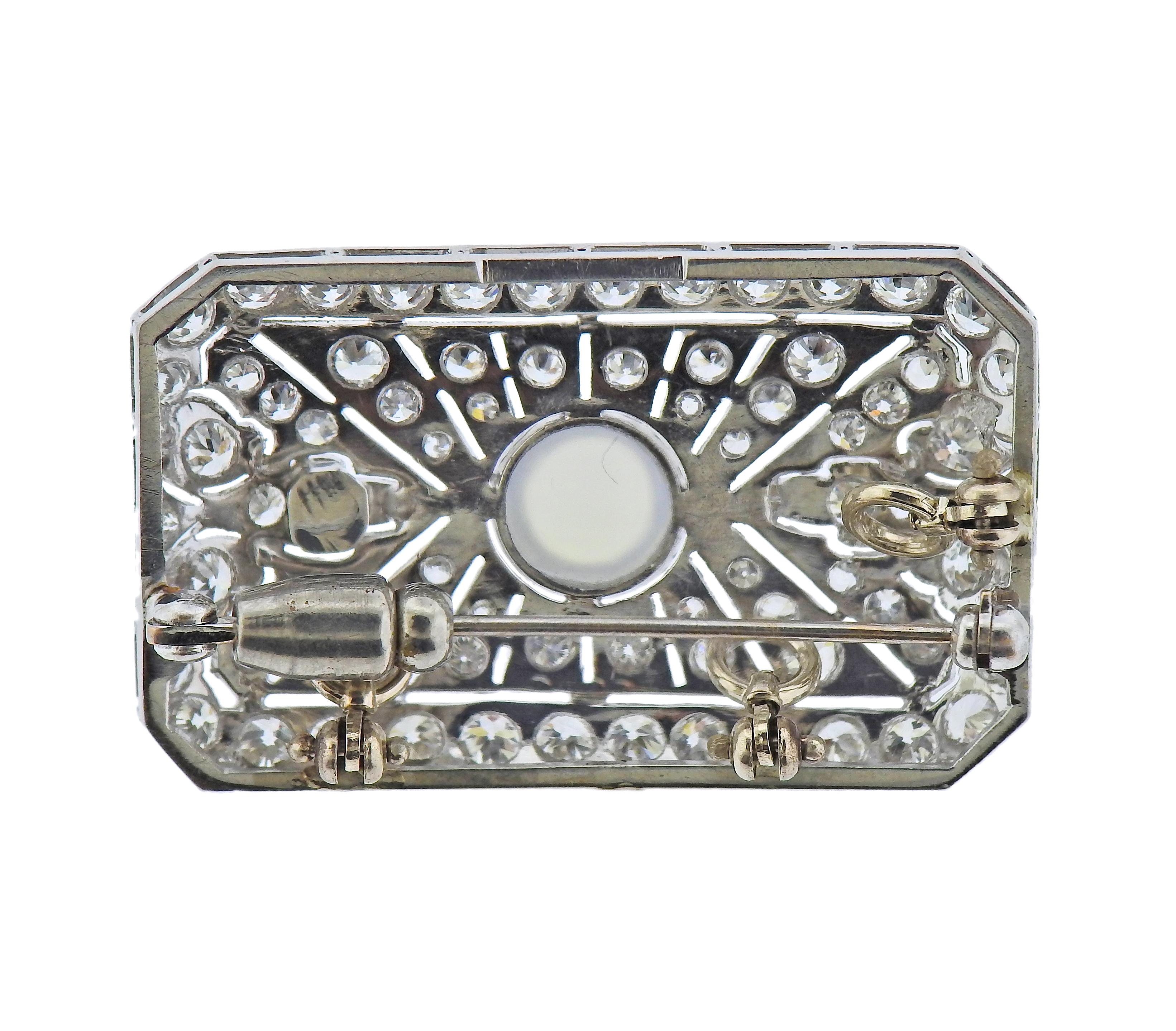 18k gold rectangular brooch/pendant, set with 7.3mm moonstone and approx. 2.20ctw in diamonds. Brooch is 35mm x 22mm. Weight - 9.1 grams.