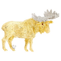 Épingle en or jaune 18 carats ornée de diamants et d
élans