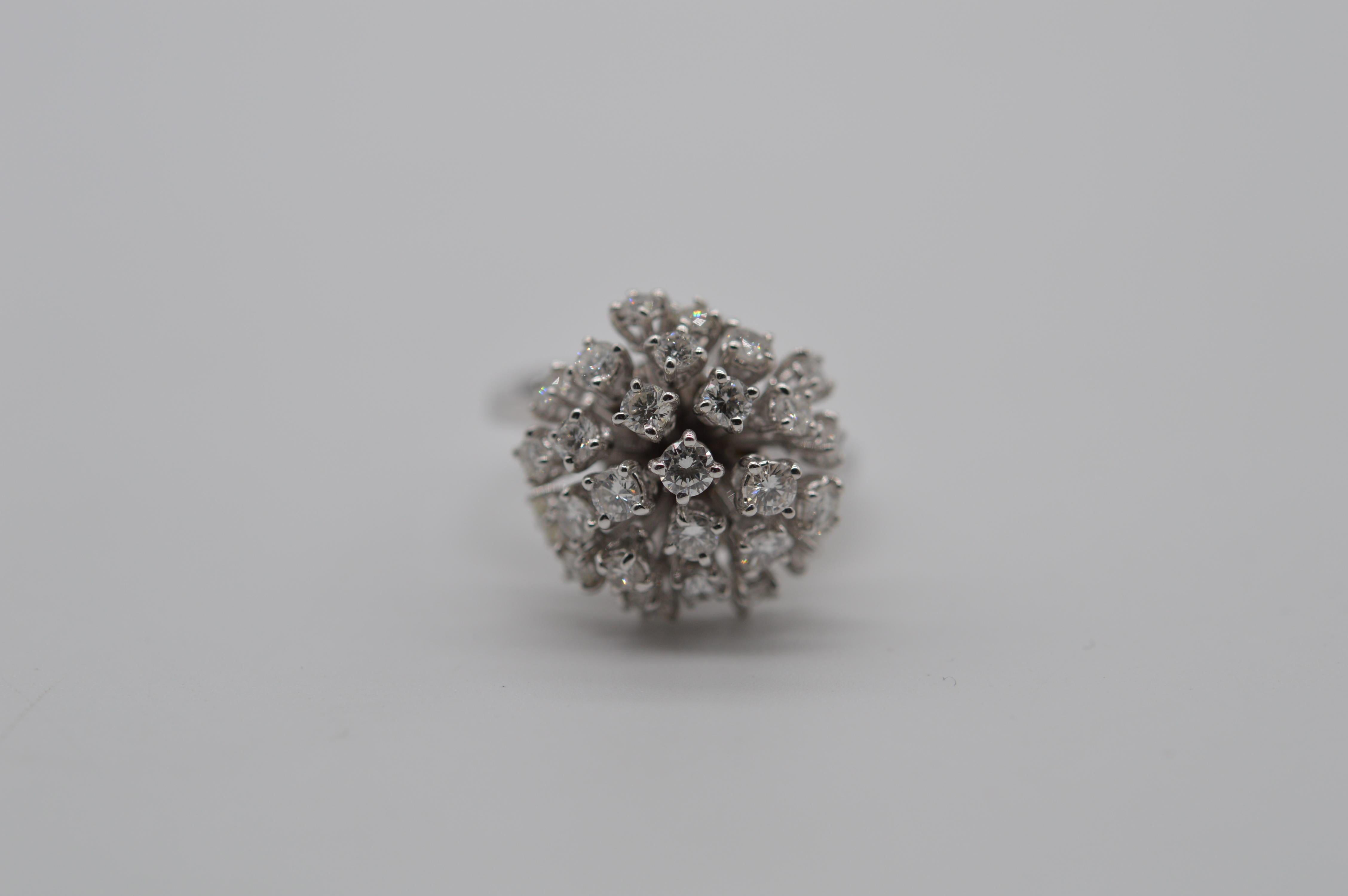 Diamond Moving Flowe Ring 1.73 carats Unworn
Mounted in an 18K White Gold
The ring size is 53.5
The total weight of the ring is 10 grams
Set with 28 Round Diamonds for a total weight of 1.73 carats
Unworn condition

