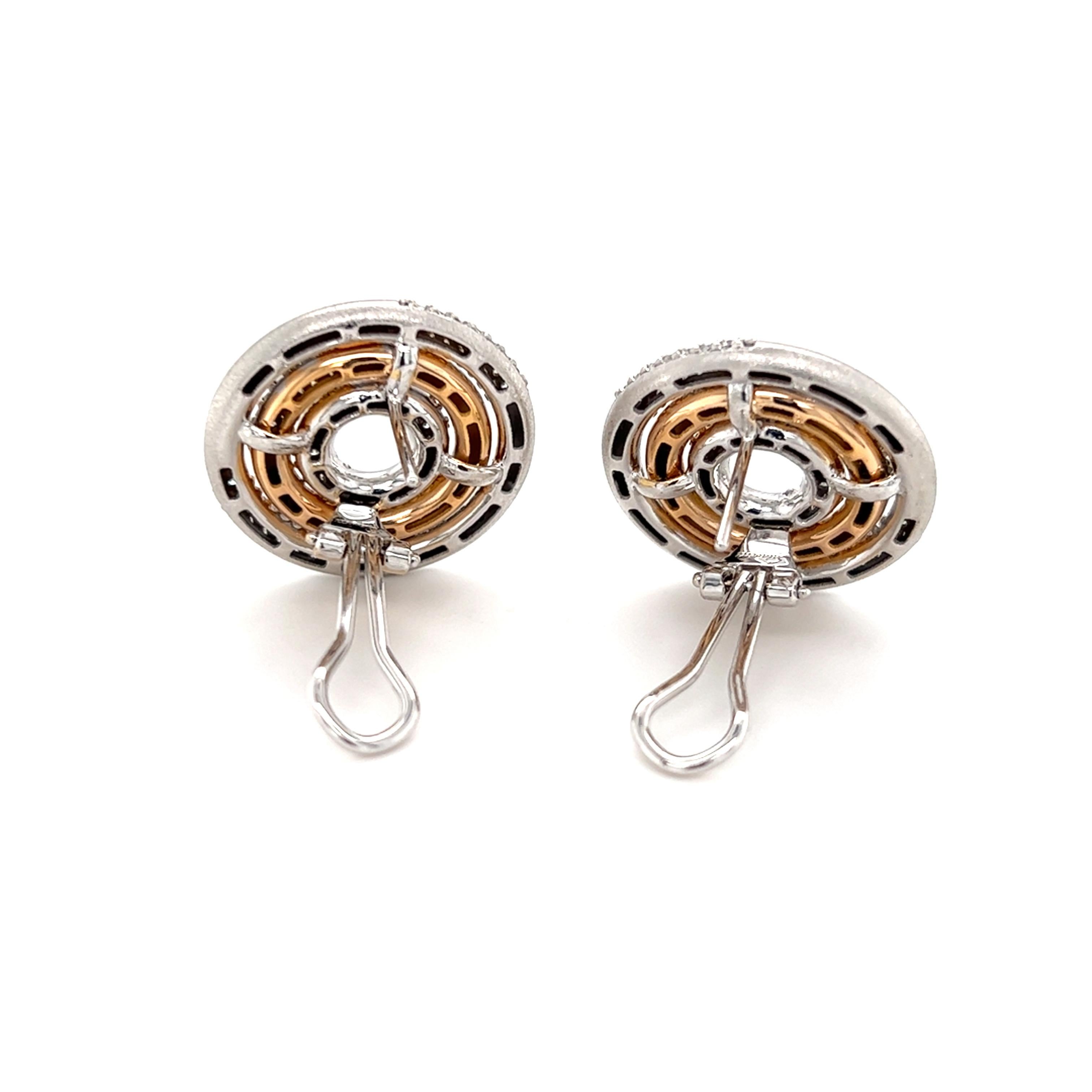 One pair of 18 karat rose and white gold multi-circle earrings by Salavetti, set with thirty (30) brown diamonds, approximately 0.30-carat total weight, and fifty-five (55) brilliant cut diamonds, approximately 0.55-carat total weight with matching
