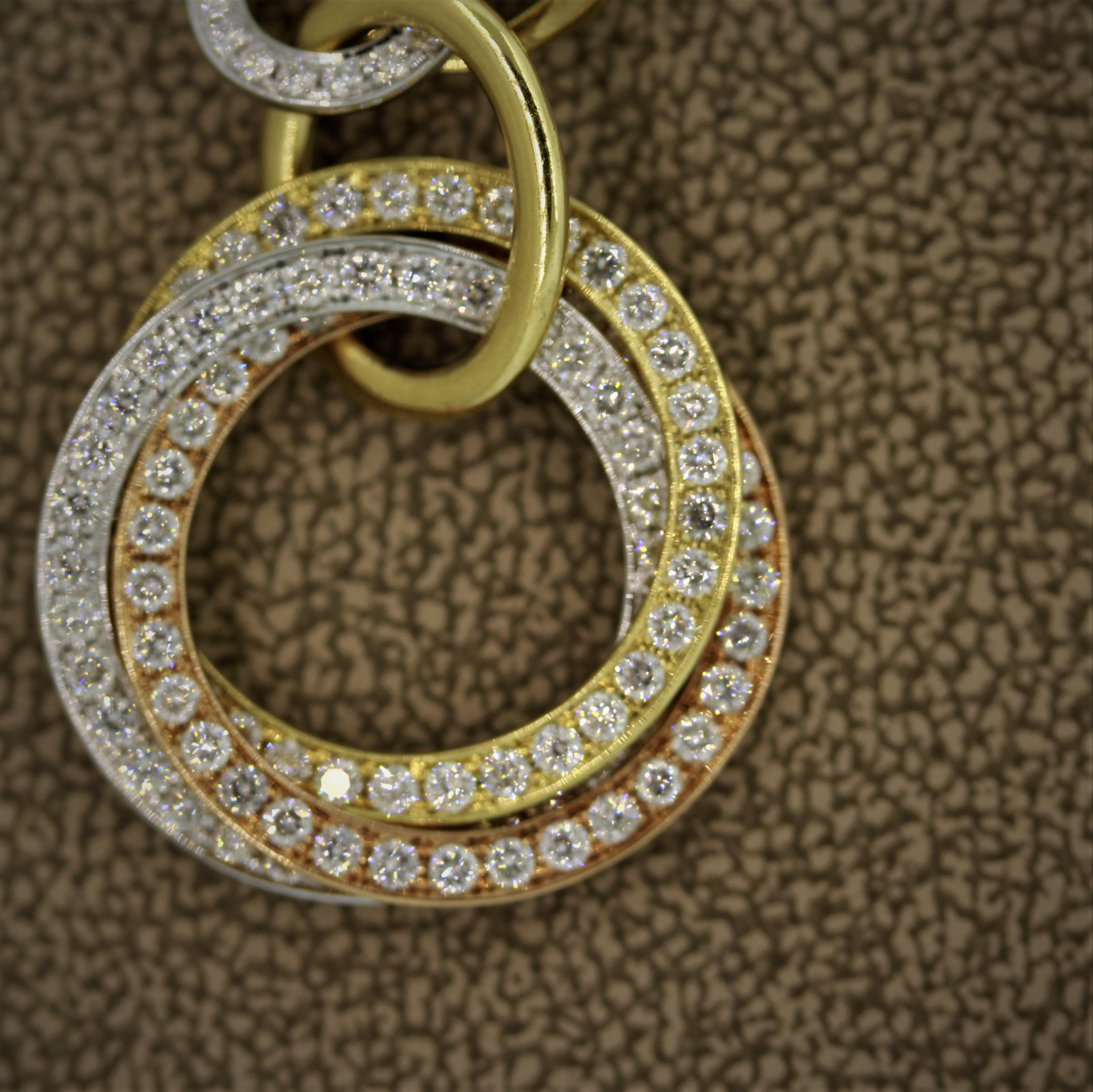 Boucles d'oreilles pendantes en or multi-anneaux avec diamants en vente 1