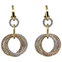 Boucles d'oreilles pendantes en or multi-anneaux avec diamants