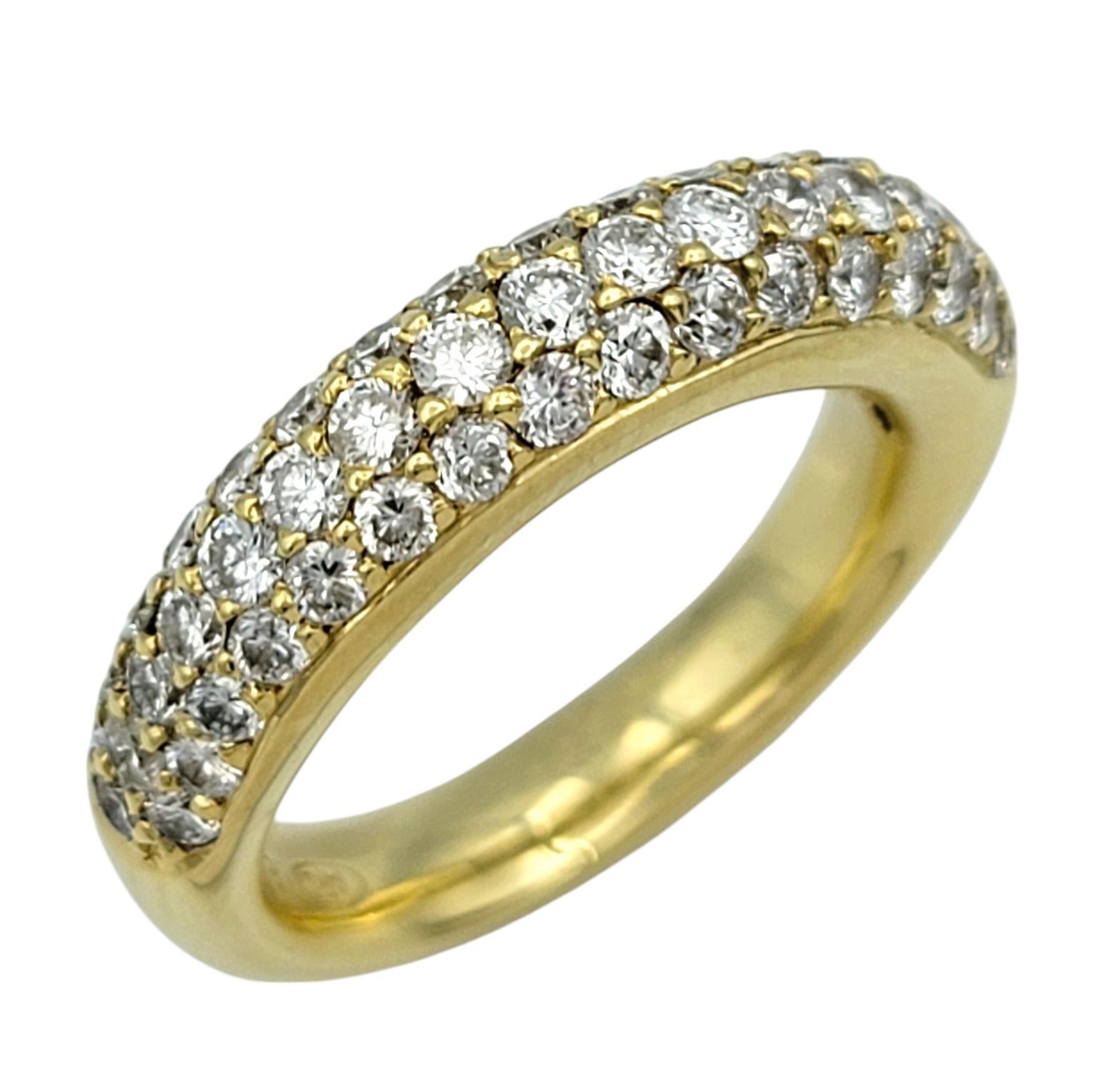 Ring Size: 7 

This stunning band ring exudes timeless elegance with its shimmering display of round brilliant-cut diamonds. Expertly set in 18 karat yellow gold, the diamonds create a dazzling pavé effect that catches the light from every angle.