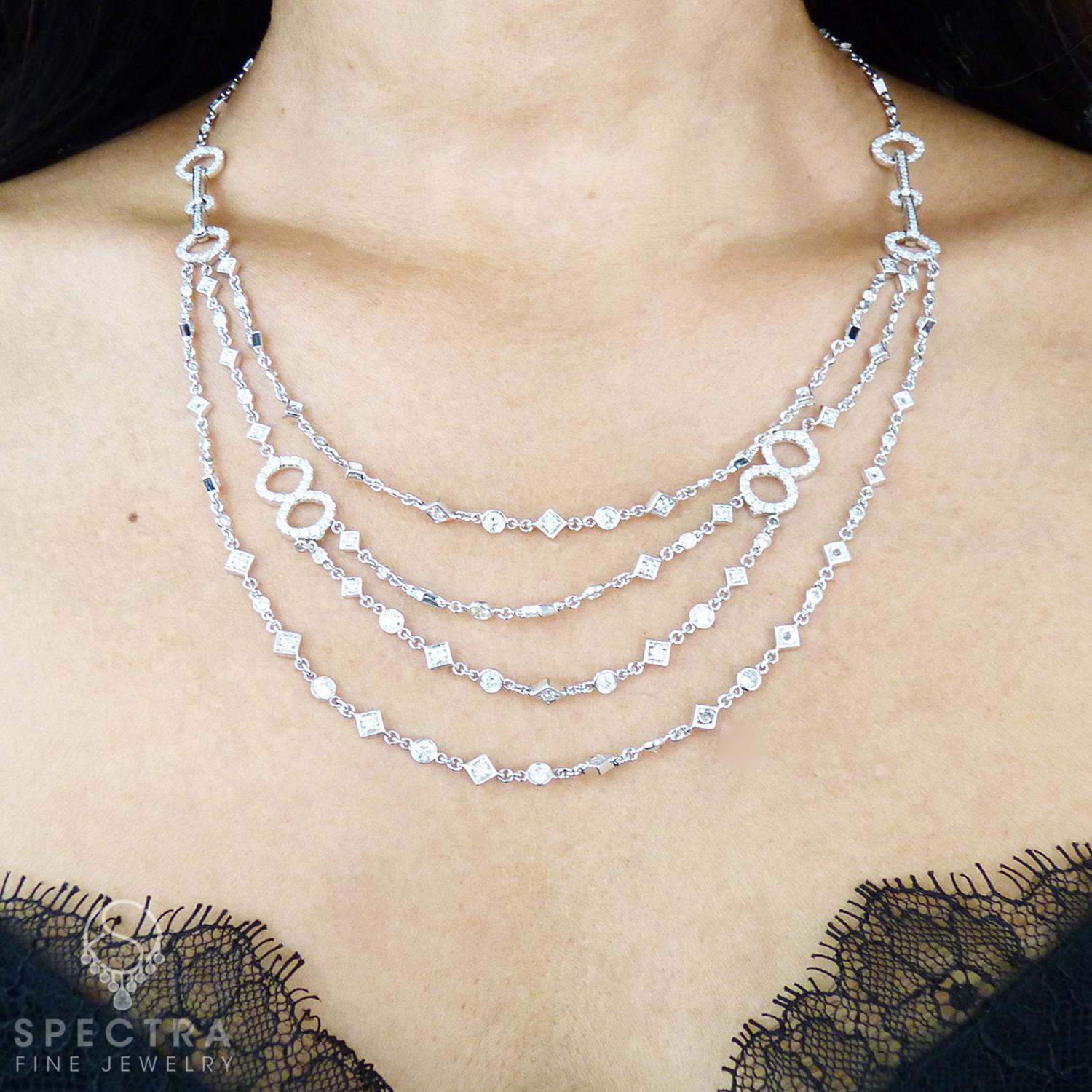 Diamond Multi-Strand Gold Necklace
A beautiful drop necklace comprising of a chain suspending four rows and embellished with round diamonds 
weighing 6.50 carats total.
The necklace is made of 18k white gold, measures 18 ins in length (45.7 cm).
The