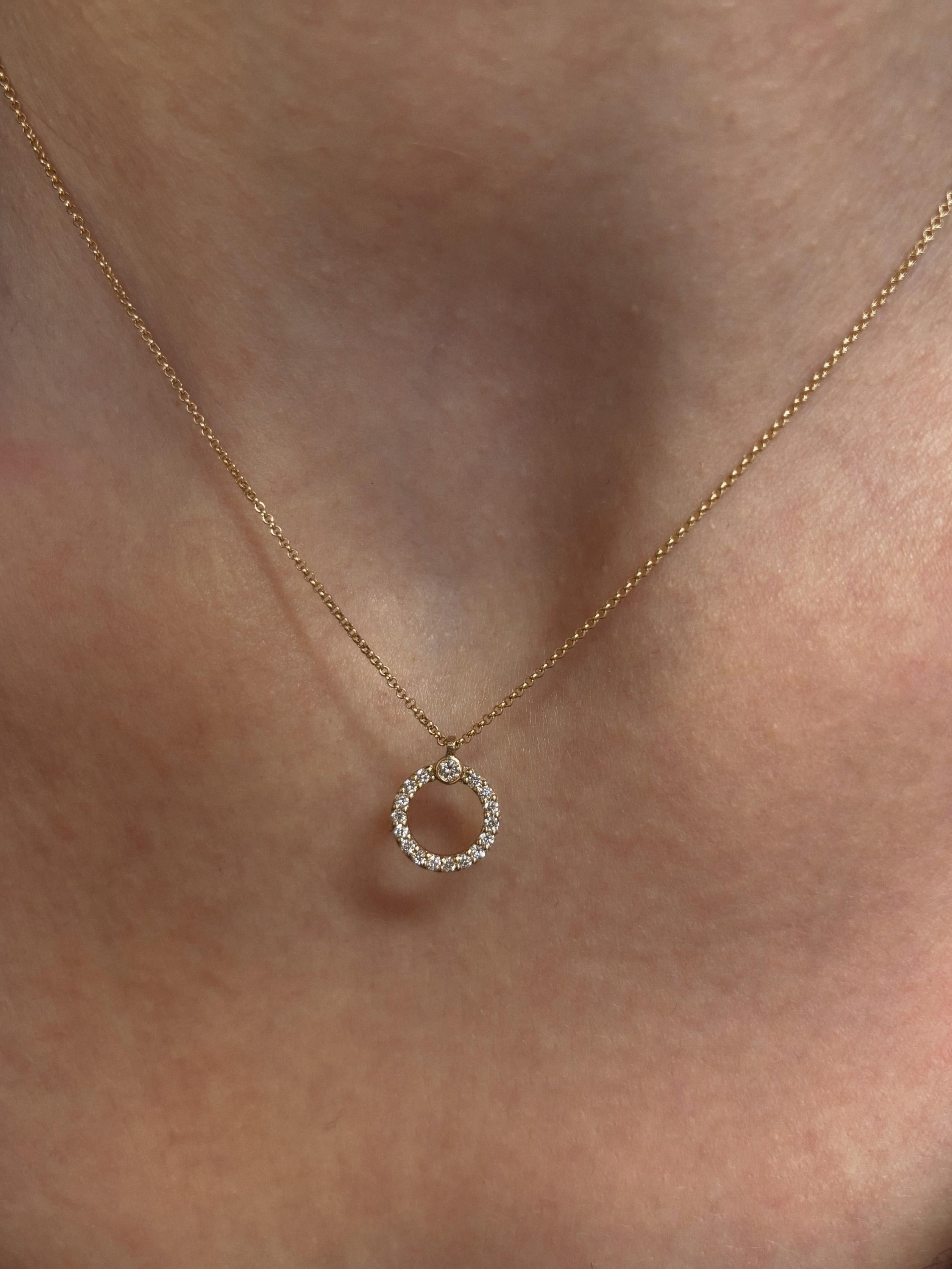 The Eternal Circle Diamond Necklace is crafted in 18Karat Yellow Gold and set with natural round glimmering diamonds. It’s modern and minimal silhouette makes it ideal for everyday wear.

We ship complimentary with DHL express worldwide shipping.