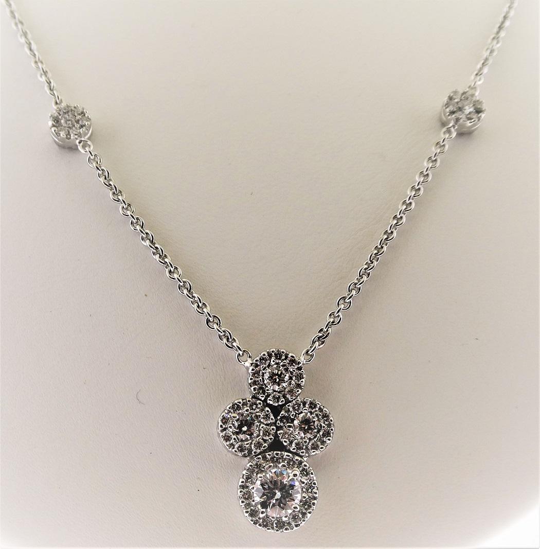 Our Diamonds by the yard necklaces have double sided motifs, so that when the necklace turns during wear, it is not noticeable.  The sides of the necklace contain 6 small stations (total of 12 circles) and the center pendant is made of 3 medium size