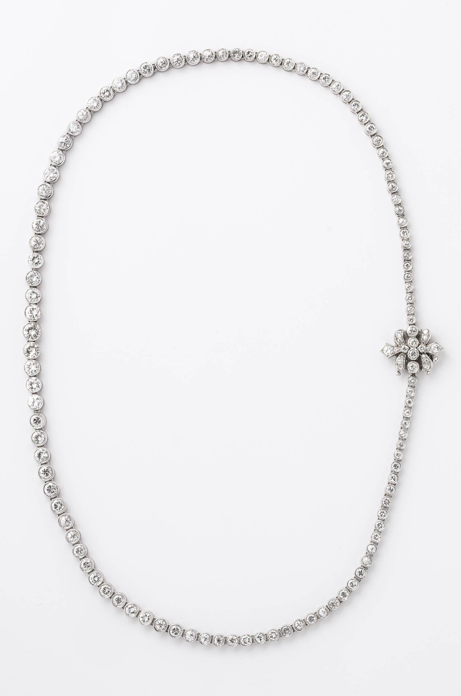 Bezel-Set Diamond Necklace in platinum consisting of 15 carats of sparkly white diamonds. The quality of the diamonds shines through.  This is a very versatile piece of jewelry. You can wear the clasp in the front or on the side for a totally