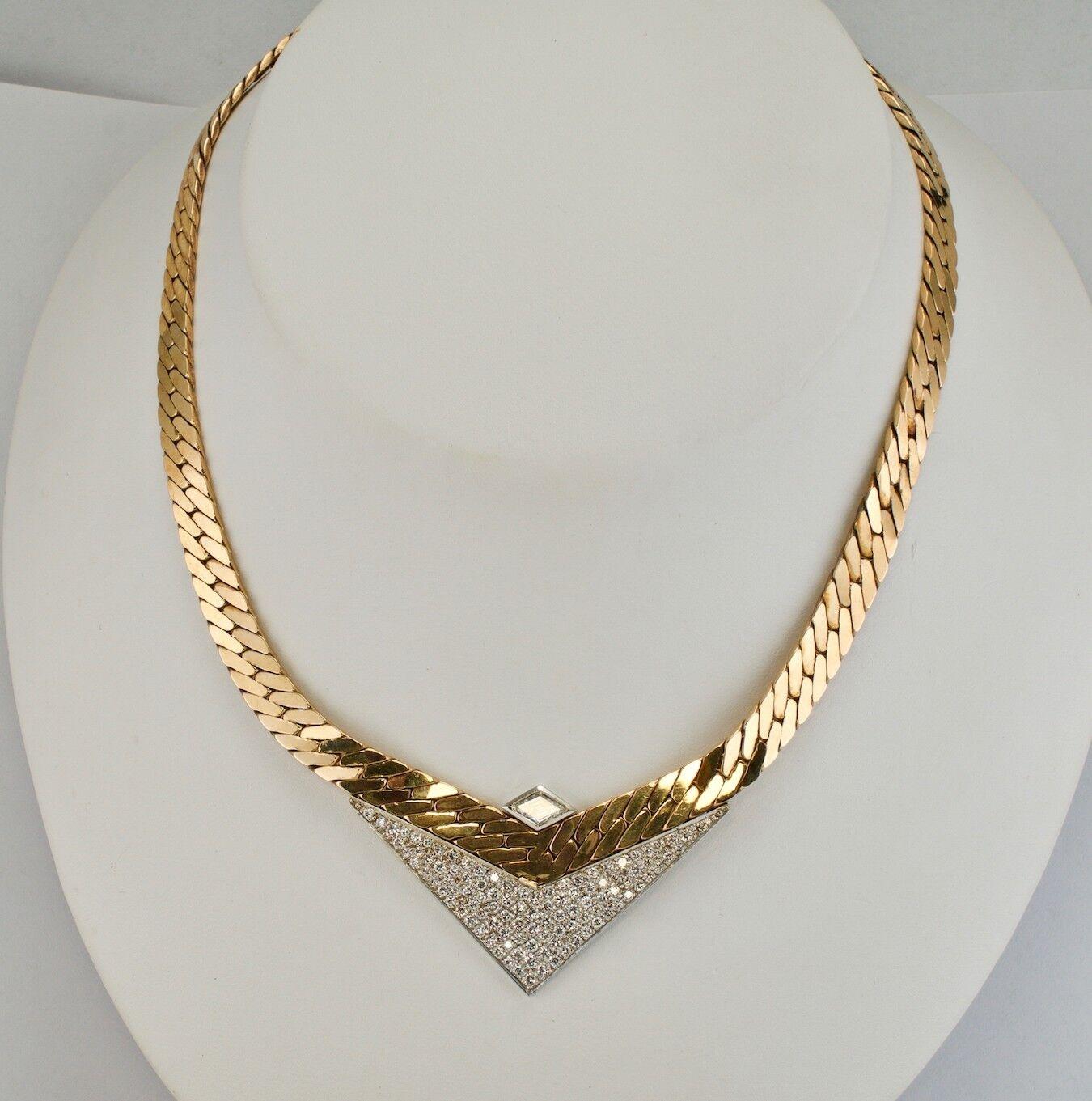 Diamond Necklace Choker 18K & 14K Gold Geometric V by Sande Italy

This amazing vintage necklace has been made in Italy and it is hallmarked Sande on the back. The necklace is crafted in a combination of solid 14K Yellow Gold and 18K White Gold. The