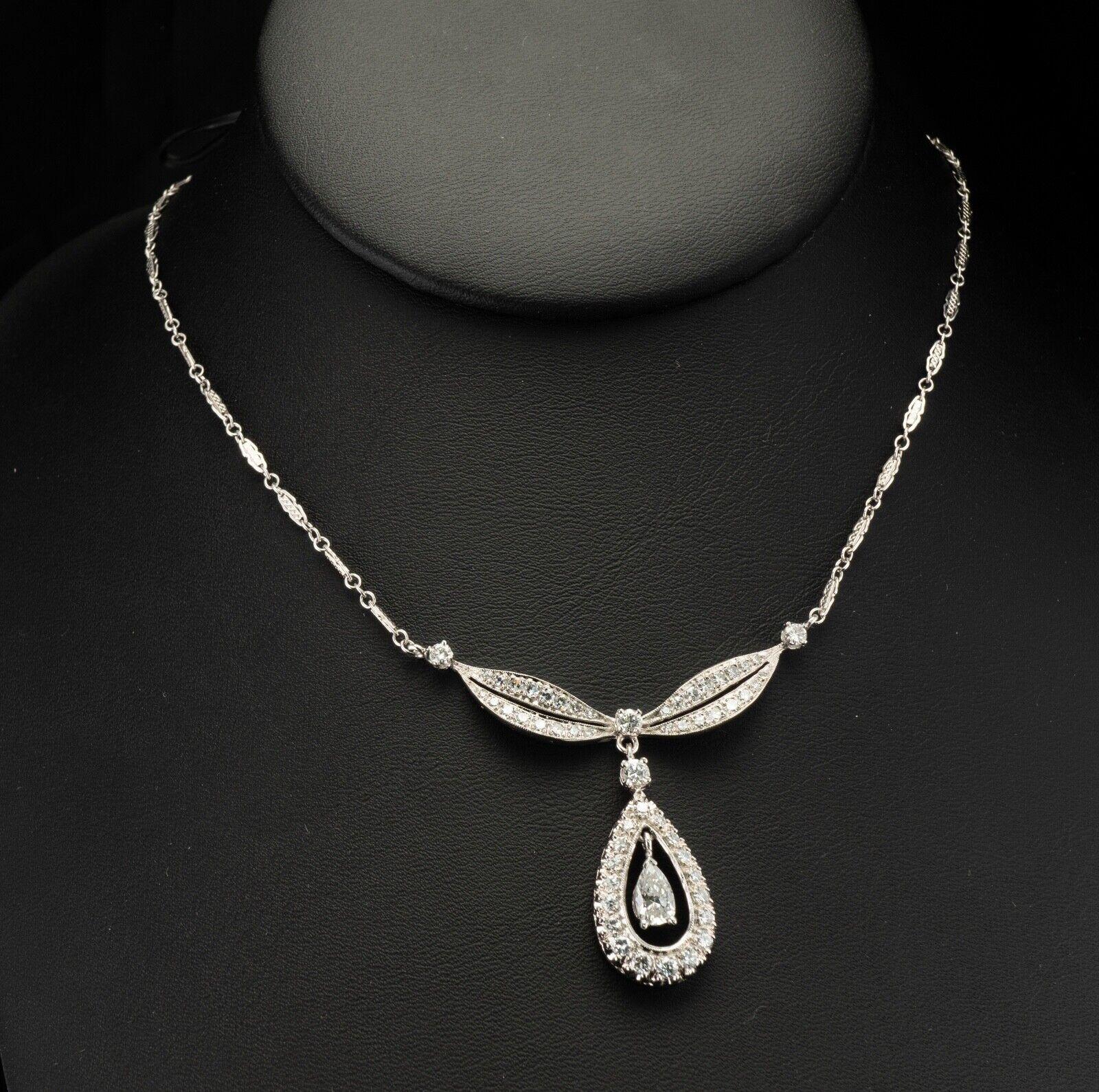 Diamond Necklace Choker Vintage 14K White Gold Teardrop Pendant 2.38 TDW

This beautiful vintage Pendant is finely crafted in solid 14K White Gold and set with white and fiery diamonds. The center pear cut diamond is .60 carat of SI2 clarity and G