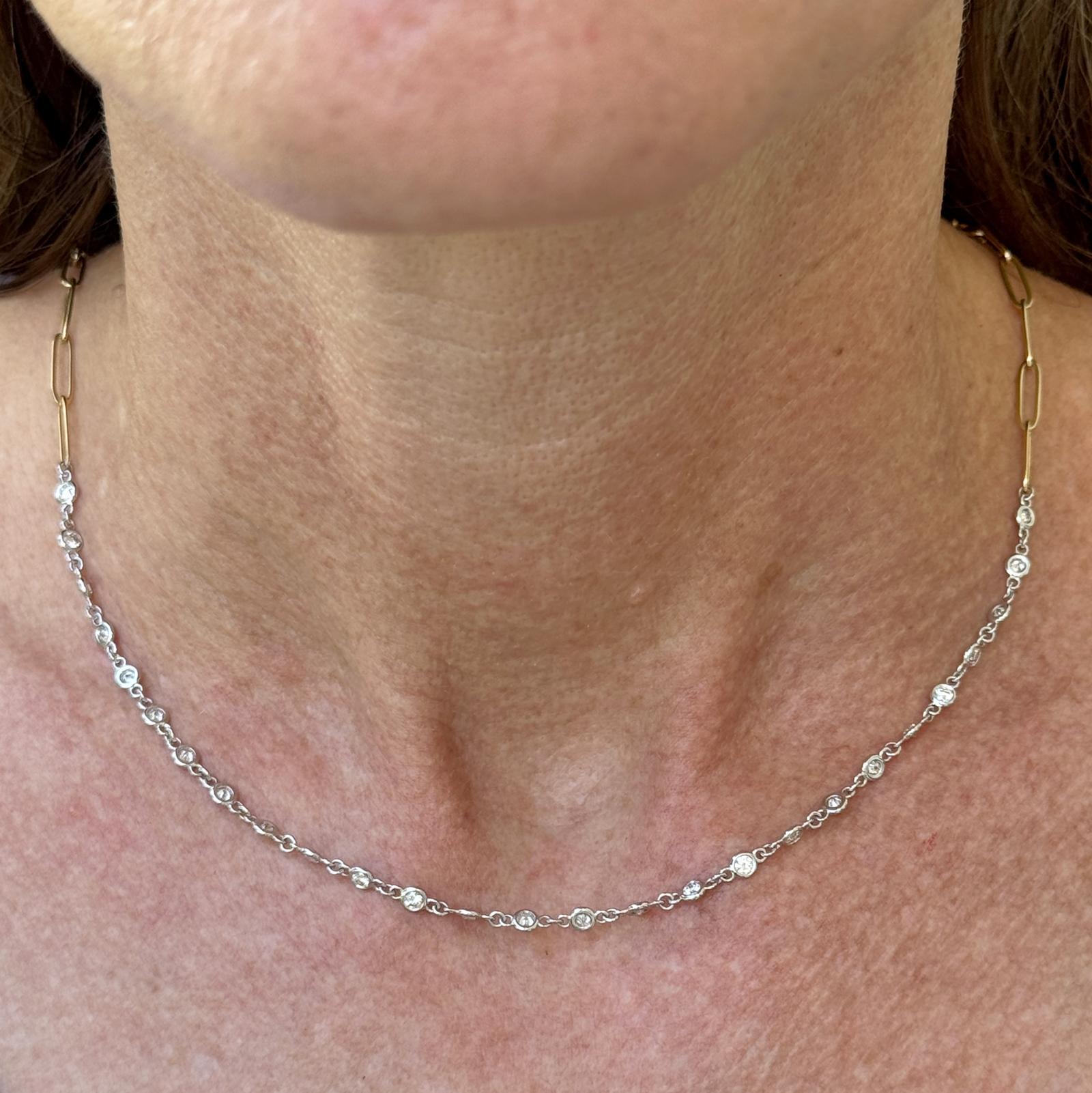 Elegant and versatile, this 17-inch necklace features 27 round brilliant cut diamonds (1.28 carat total weight, G–H color, VS clarity) bezel-set in 14k white gold and evenly spaced in a classic 