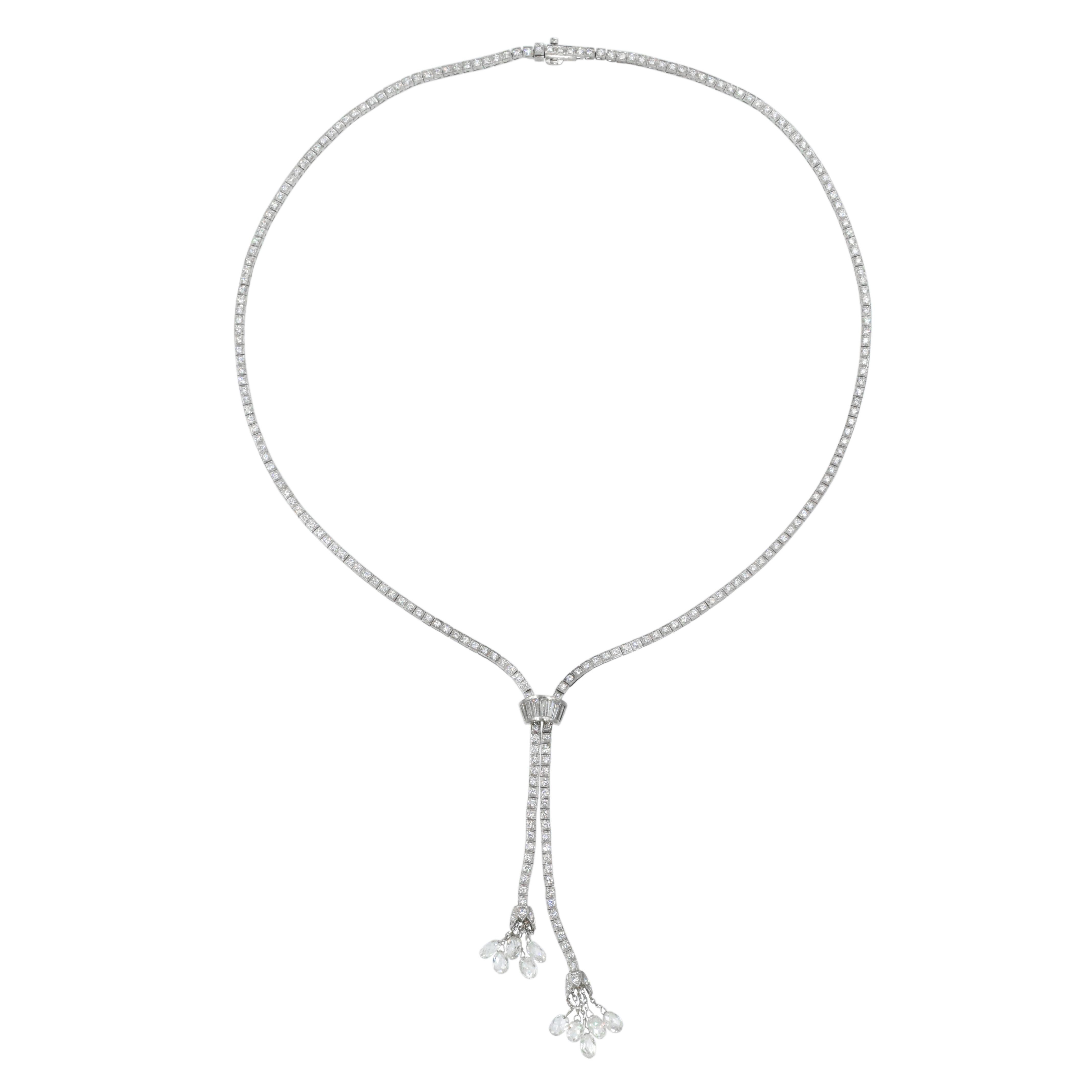Simple & Elegant!

Beautiful diamond necklace. Two ends connected together with channel set baguette shape diamond band and  hanging tassel with 10 briolettes.

Estimated total weight of the diamonds is 10.30 carats
Length: 10 inches
Platinum
