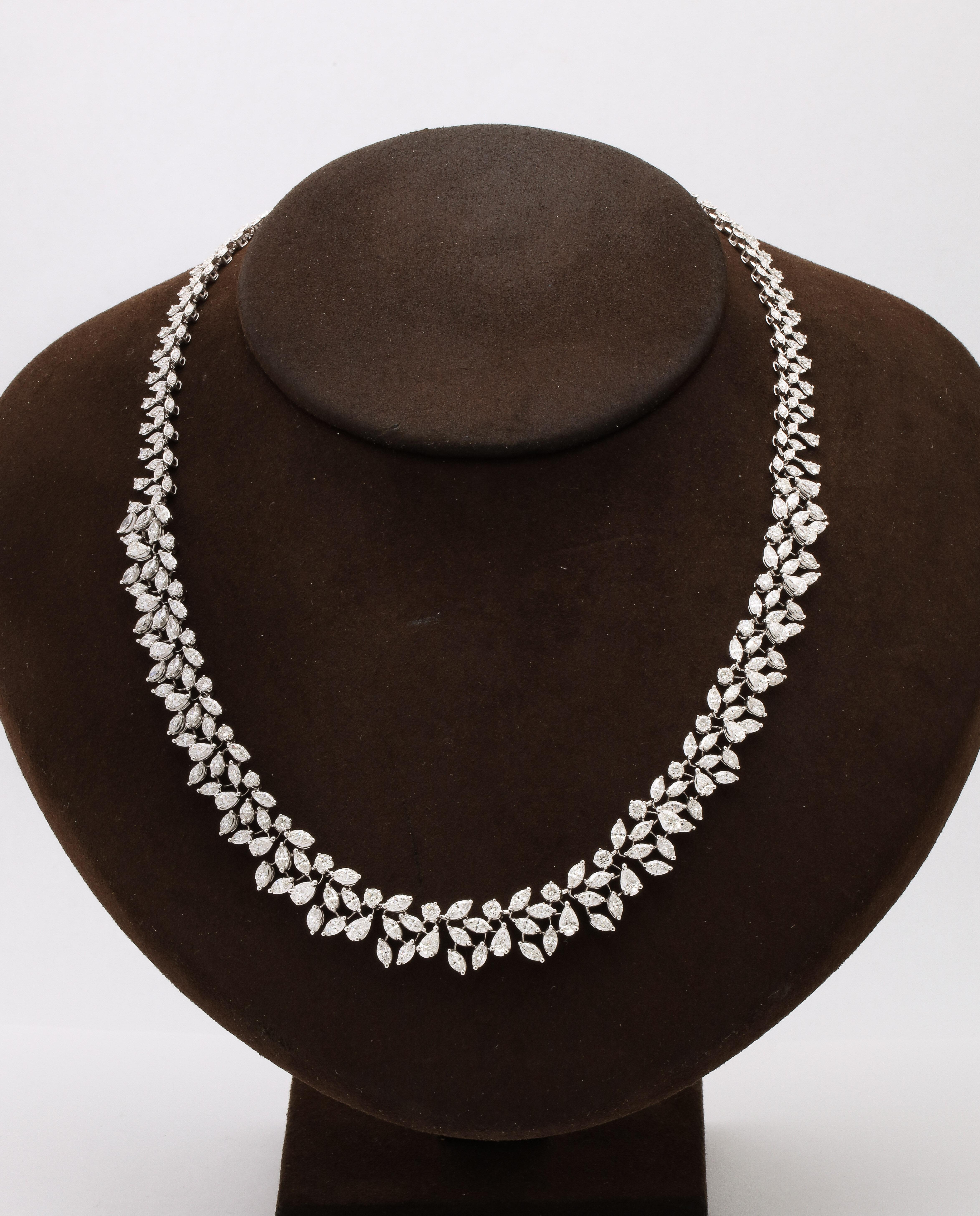 
A timeless design! 

17.53 carats of white pear, round and marquise shape diamonds set in 18k white gold. 

Half an inch wide in the center.  

17.5 inch length 

A fresh take on the iconic wreath necklace. 