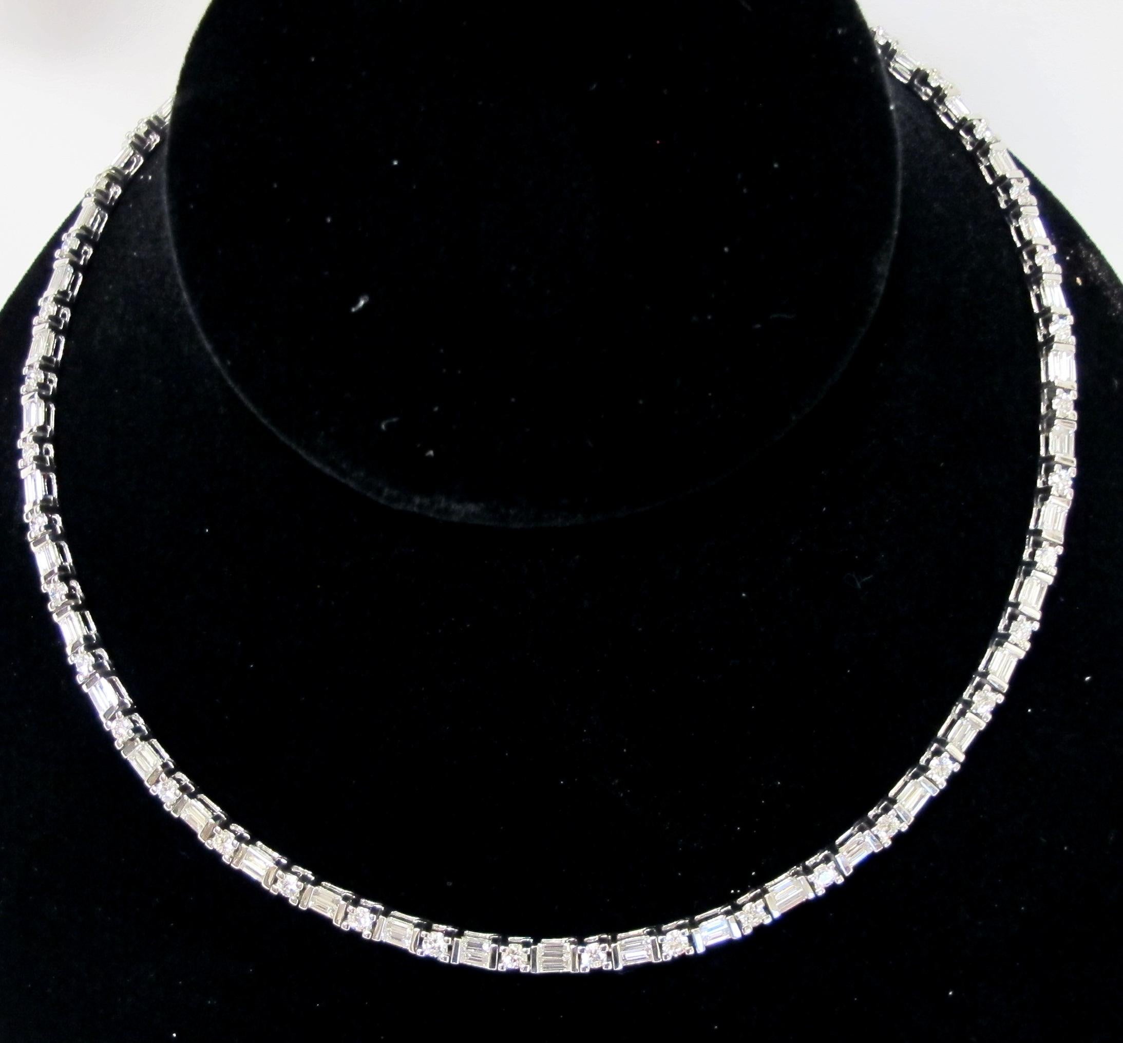 14 karat white gold necklace with 86 baguette cut diamonds and 43 round brilliant cut diamonds with a total diamond weight of 8.60 carats.  G-H in Color.  VS in clarity.  29 grams.