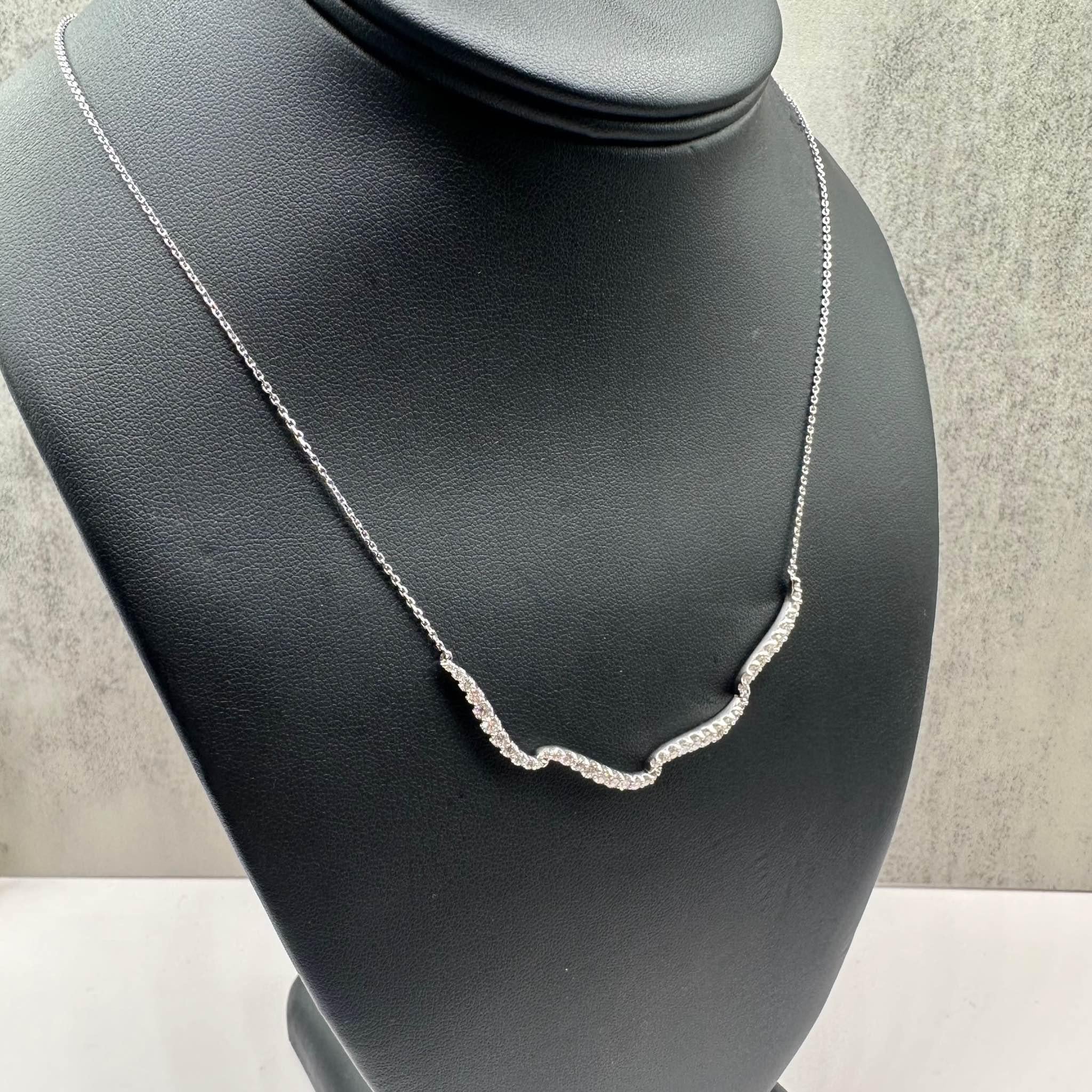 This stunning Diamond Necklace in 14kt white gold features 1.25ctw of natural GH SI-I1 round diamonds, offering brilliant sparkle in a sleek and elegant design. The necklace is adjustable between 16 and 18 inches, making it perfect for various