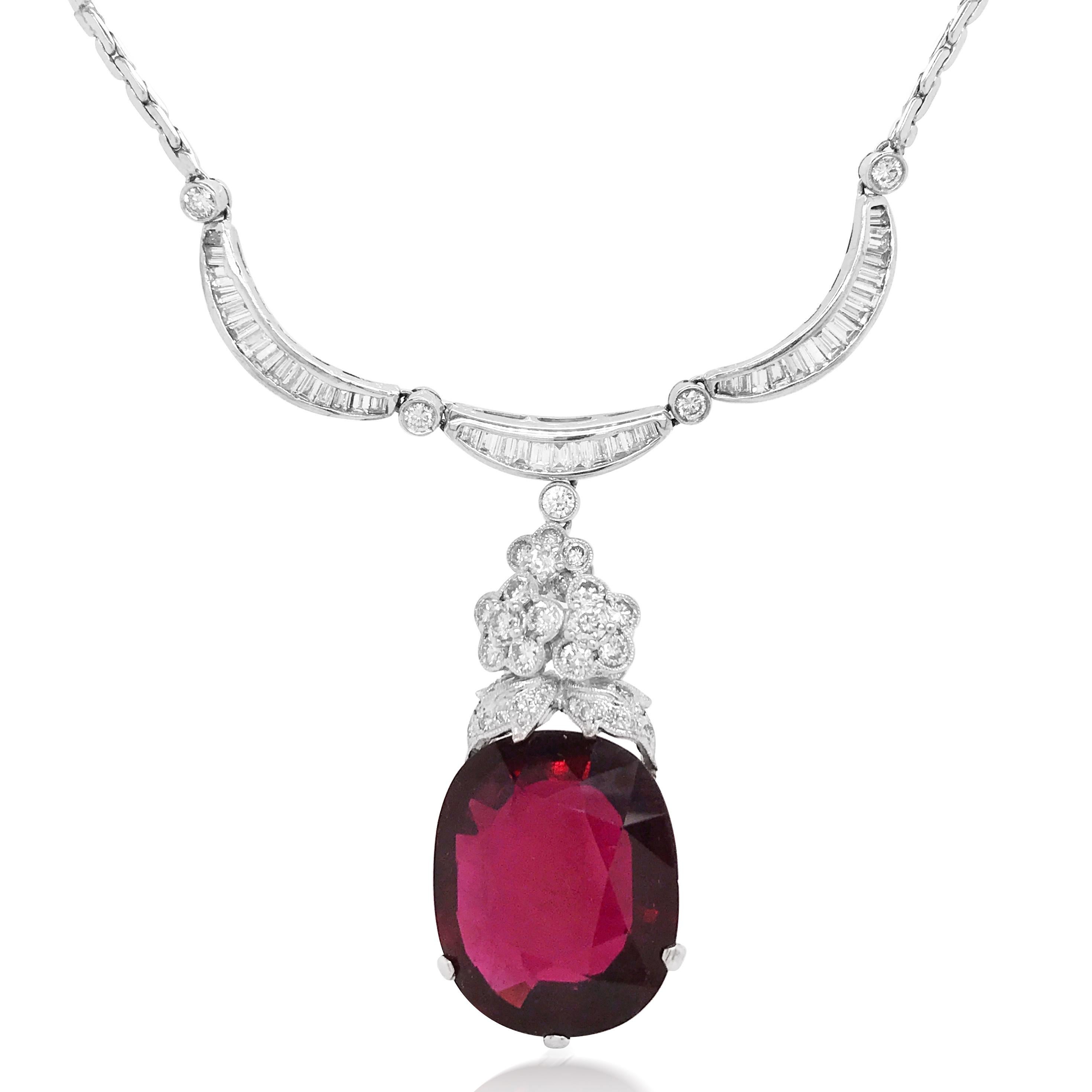 This breathtaking pendant features a beautiful garnet and round and baguette-cut diamond. The floral shape of diamonds is linked to the intense red garnet to form a stylish long drop design. In all, this garnet pendant necklace looks impeccably