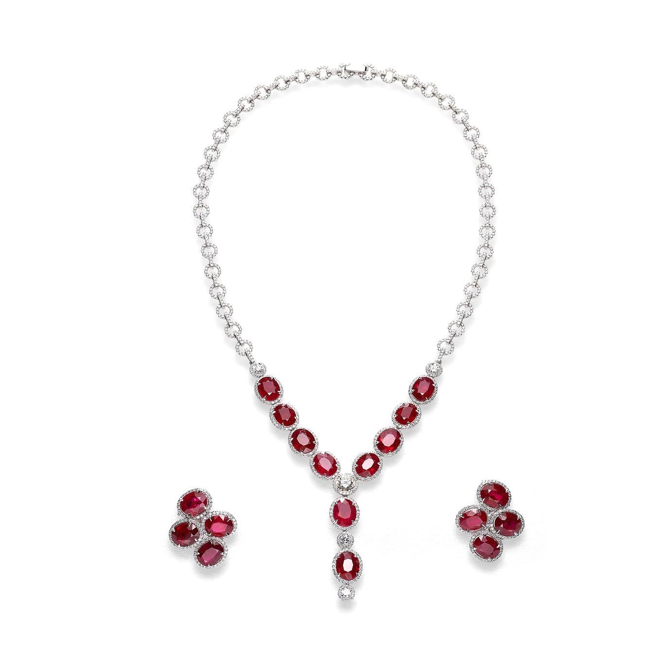 Necklace and earrings in 18kt white gold set with 2 oval cut rubies 0.53 ctss and 41 baguette cut diamonds 0.51 cts and 40 diamonds 0.28 cts