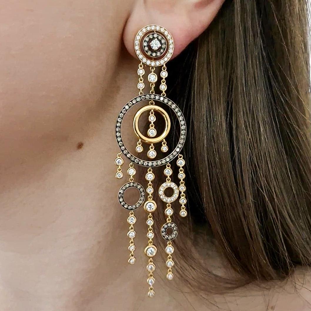 Diamond white and fancy brown 
on yellow and blacken gold 18k 
Ear Pendants.
Clip and Pierced ear system.

Total height: 3.74 inches / 9.50 centimeters.
Width at maximum: 0.98 inch / 2.50 centimeters.
Total weight: 27.63 grams.