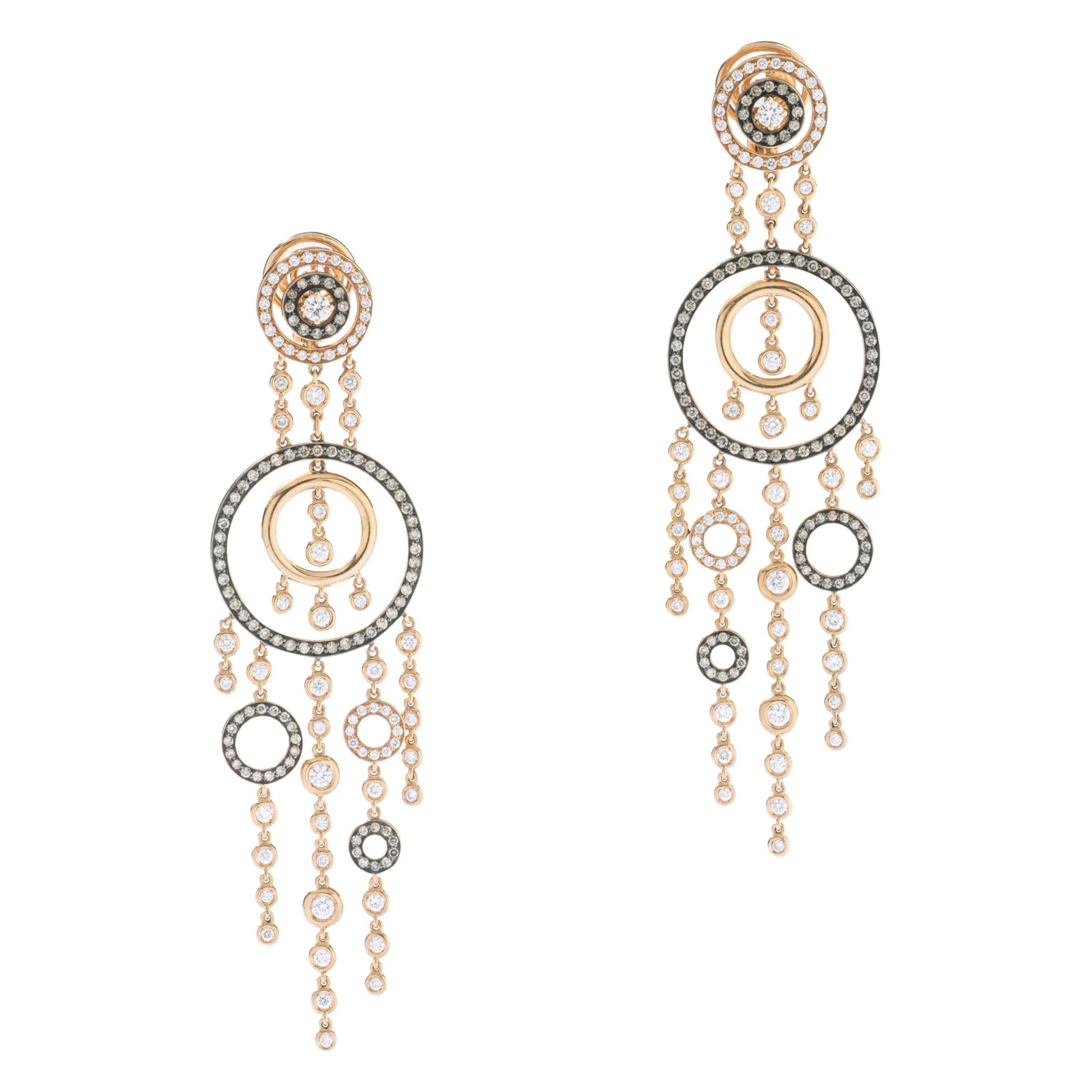 Orecchini con diamante e pendente in oro