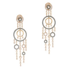 Orecchini con diamante e pendente in oro