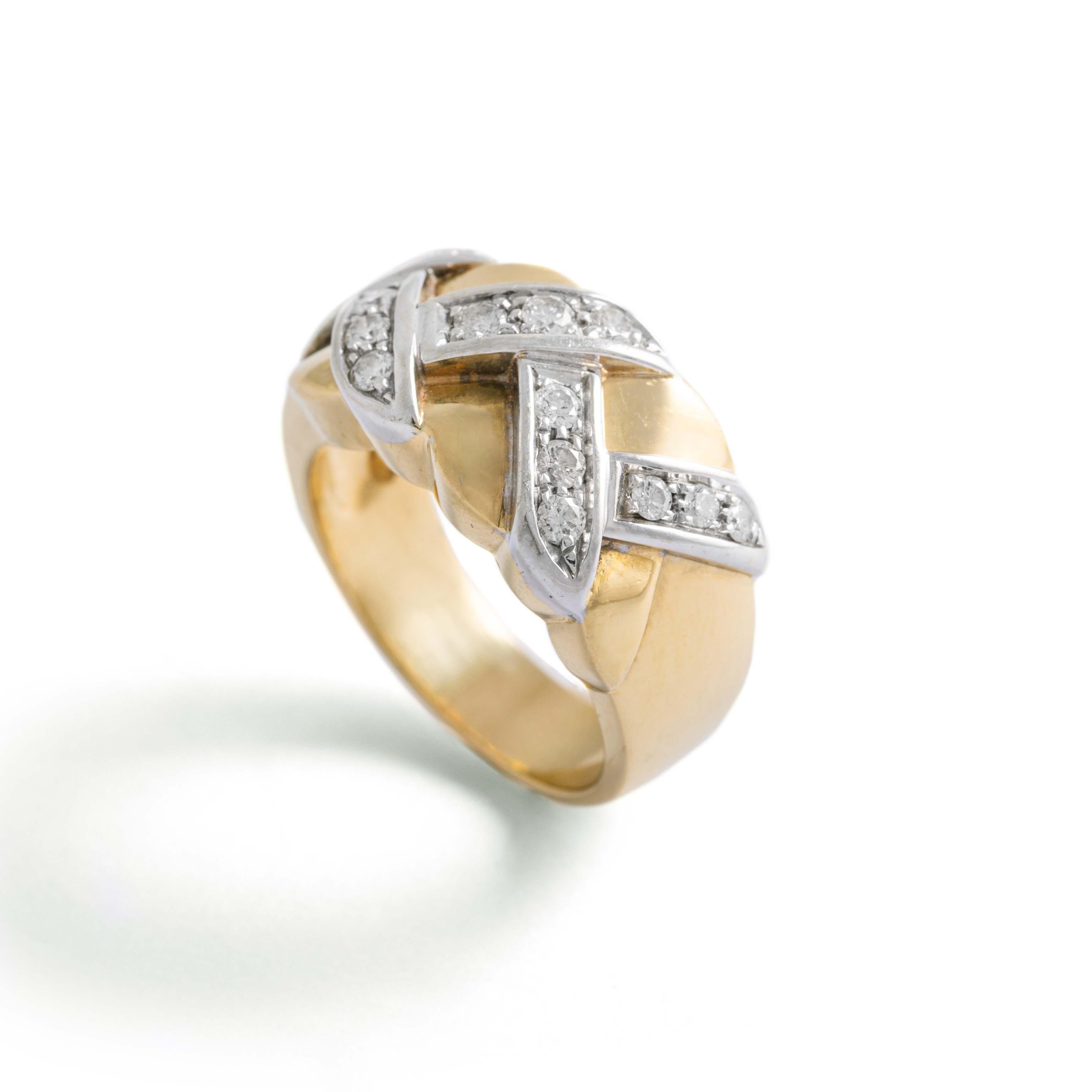 18K yellow and white gold ring set with round-cut diamonds.
Probably Pomellato, not signed.
Size: 58. 
Gross weight: 16.95 grams.