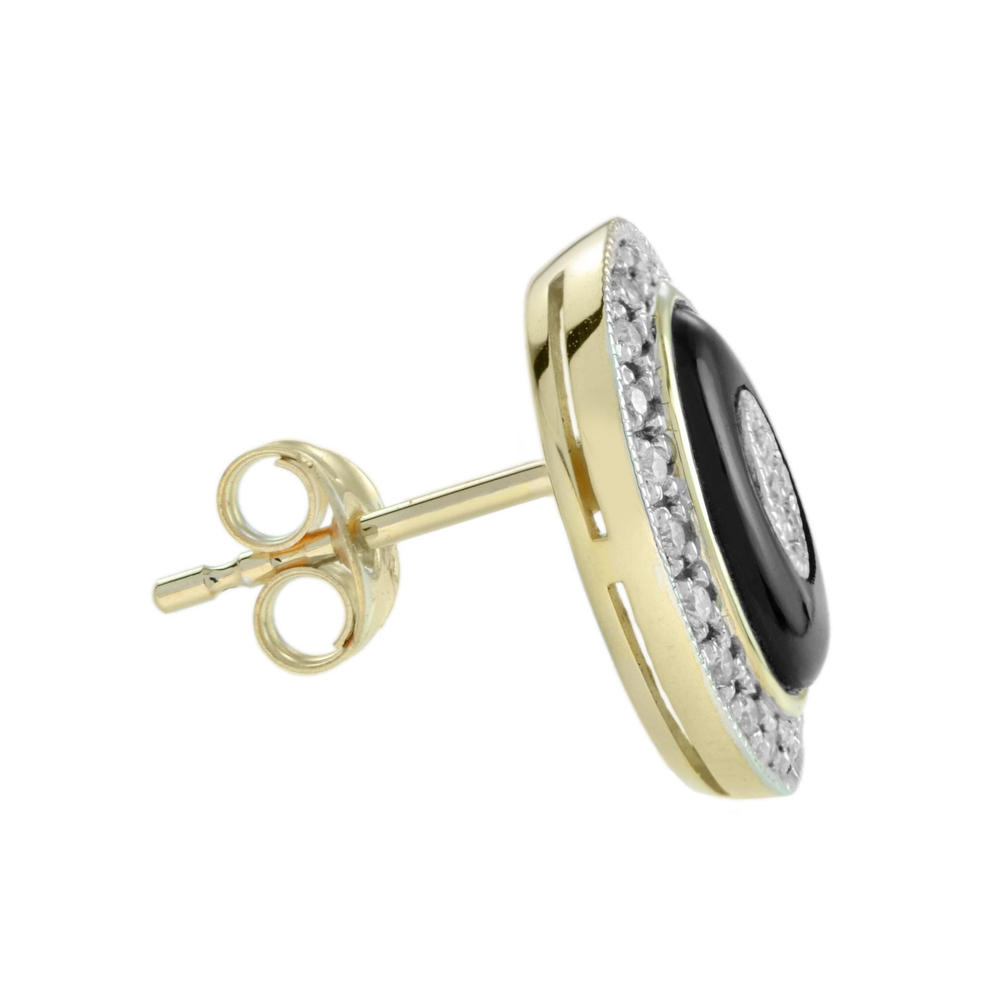 This beautiful pair of unique stud earrings feature an oval cut black onyx inlaid and set with diamond cluster and surrounded by a diamond halo. These earrings are crafted in 18k yellow gold and finished with milgrain edging. These art deco inspired