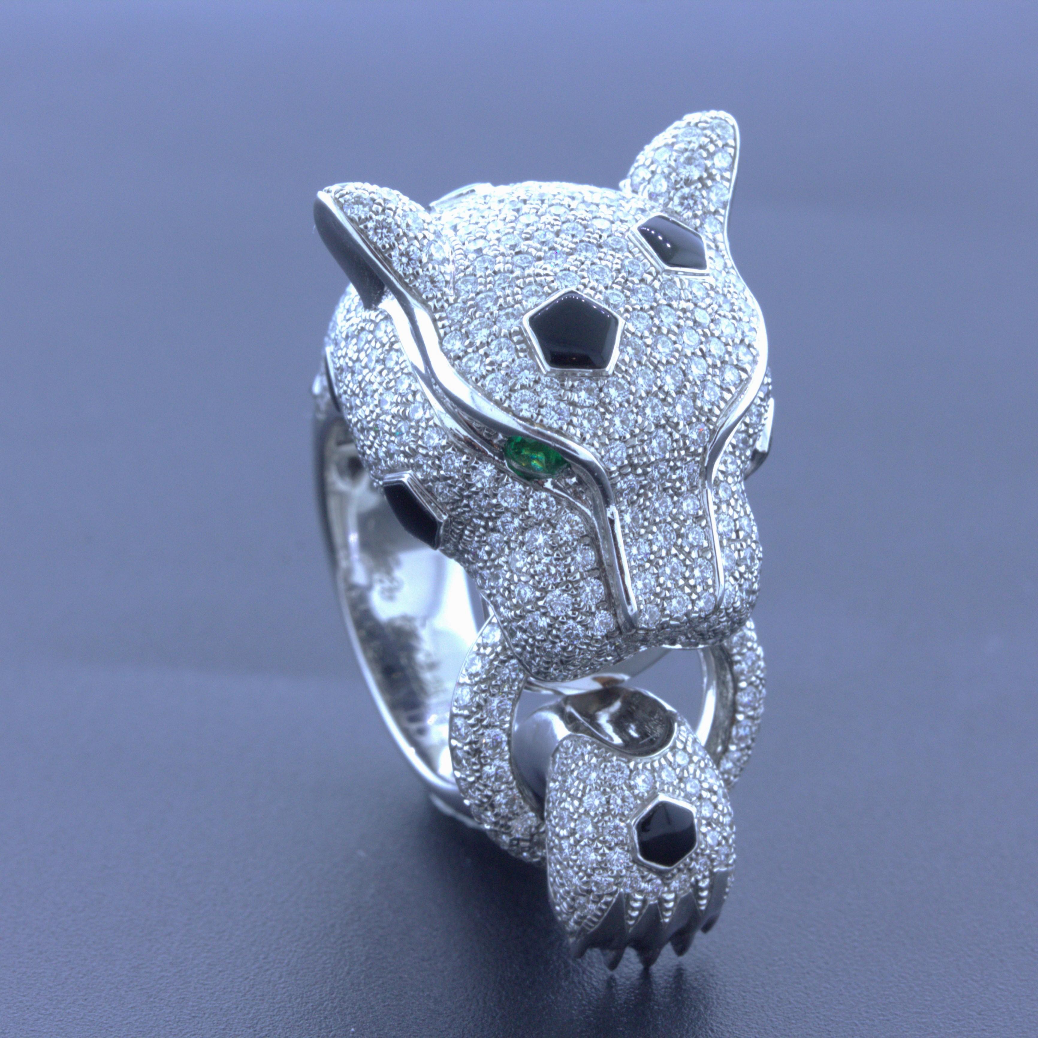 A large and lifelike panther studded with diamonds is ready to sit atop your fingers! The panther constructed in 18k white gold is covered with 3.18 carats of bright white round brilliant-cut diamonds. There are spots of hand-polished black onyx