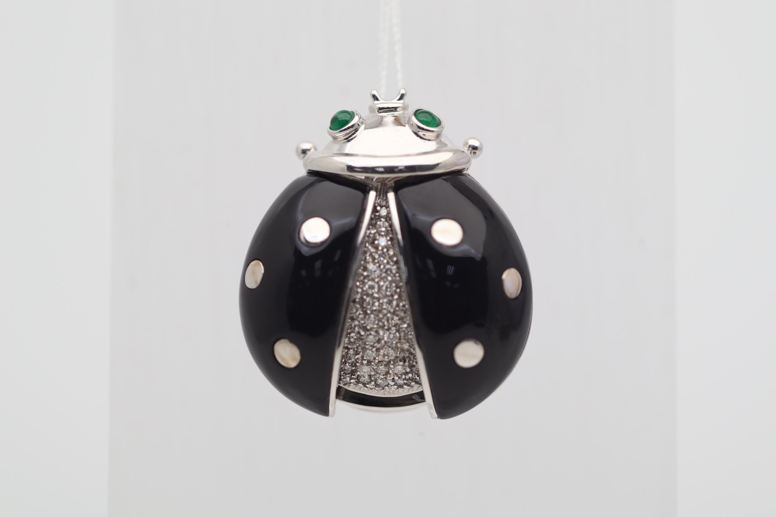 A fun, stylish, and unique piece designed into a lucky Ladybug! Its two wings are made with black onyx and 18k white gold spots. Its body is studded with 0.50 carats of round brilliant-cut diamonds adding sparkle and brightness to the piece, while