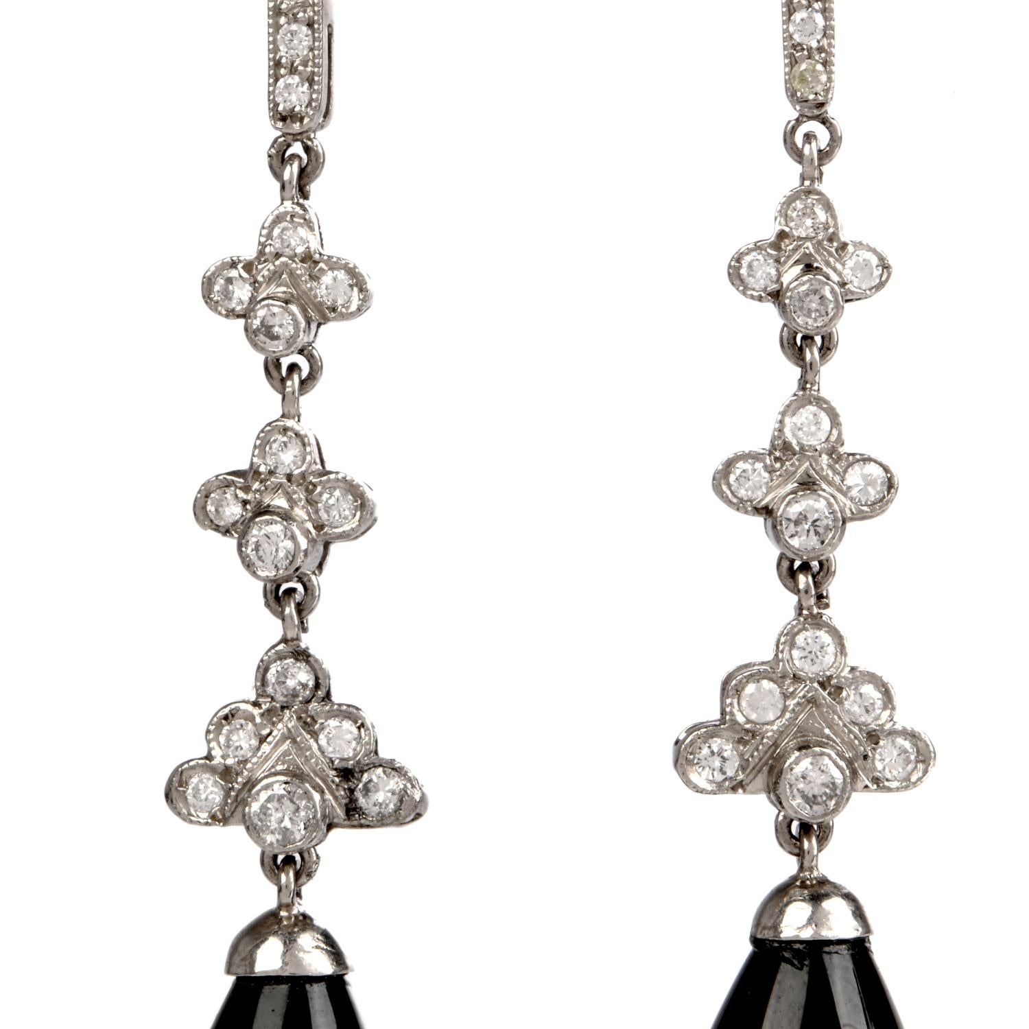 These fashionable diamond & onyx dangle drop earrings are crafted in solid platinum, weighing 9.7 grams and measuring 2 ¼ “long. Composed of a beautiful diamond studded drop featuring 38 round diamonds, bezel and prong set, collectively weighing