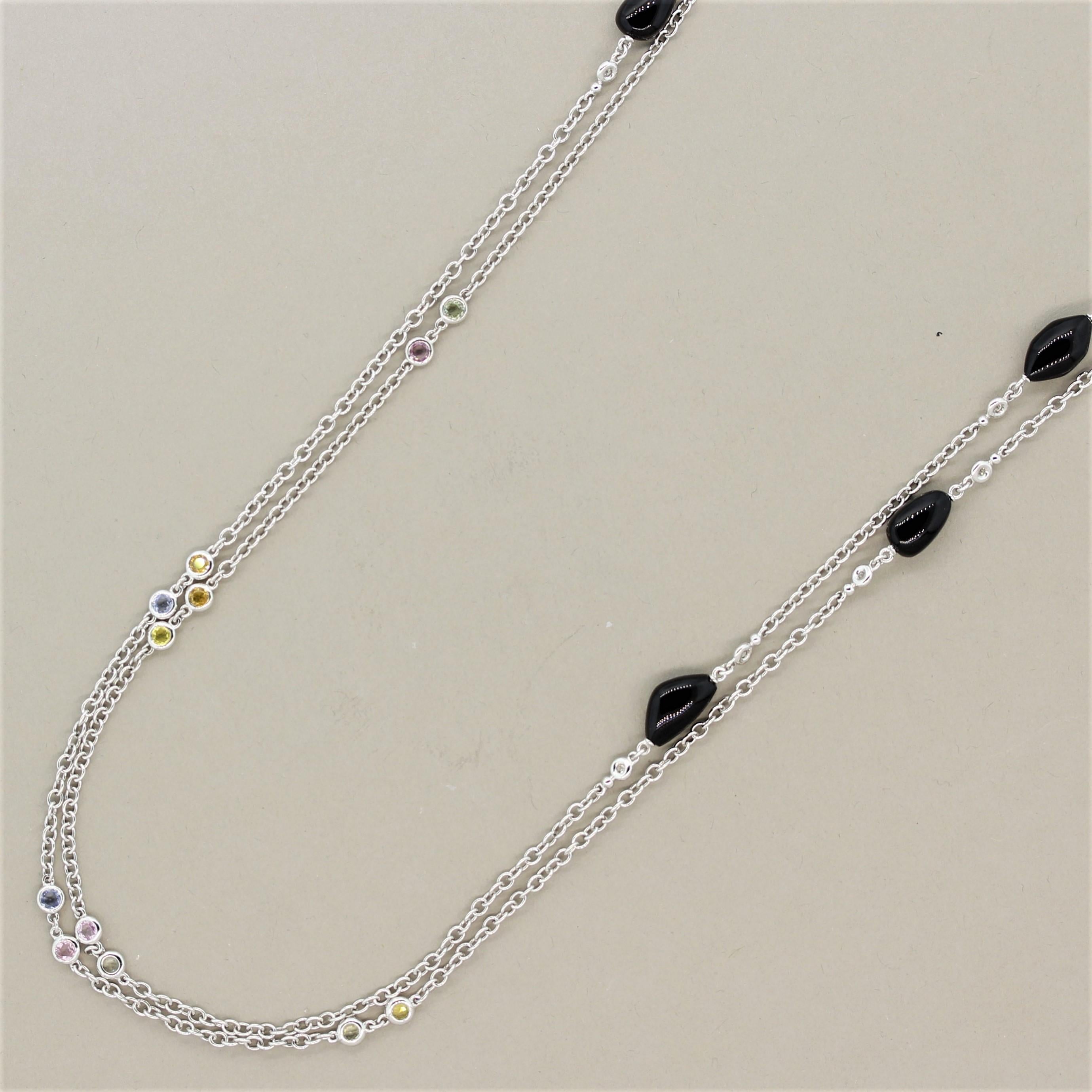 A unique necklace measuring 60 inches designed to wear long or looped over itself for a shorter double strand look. It features 10 black onyx beads with a smooth polish. Each onyx has 2 round brilliant cut diamonds bezel set on its sides. Adding to