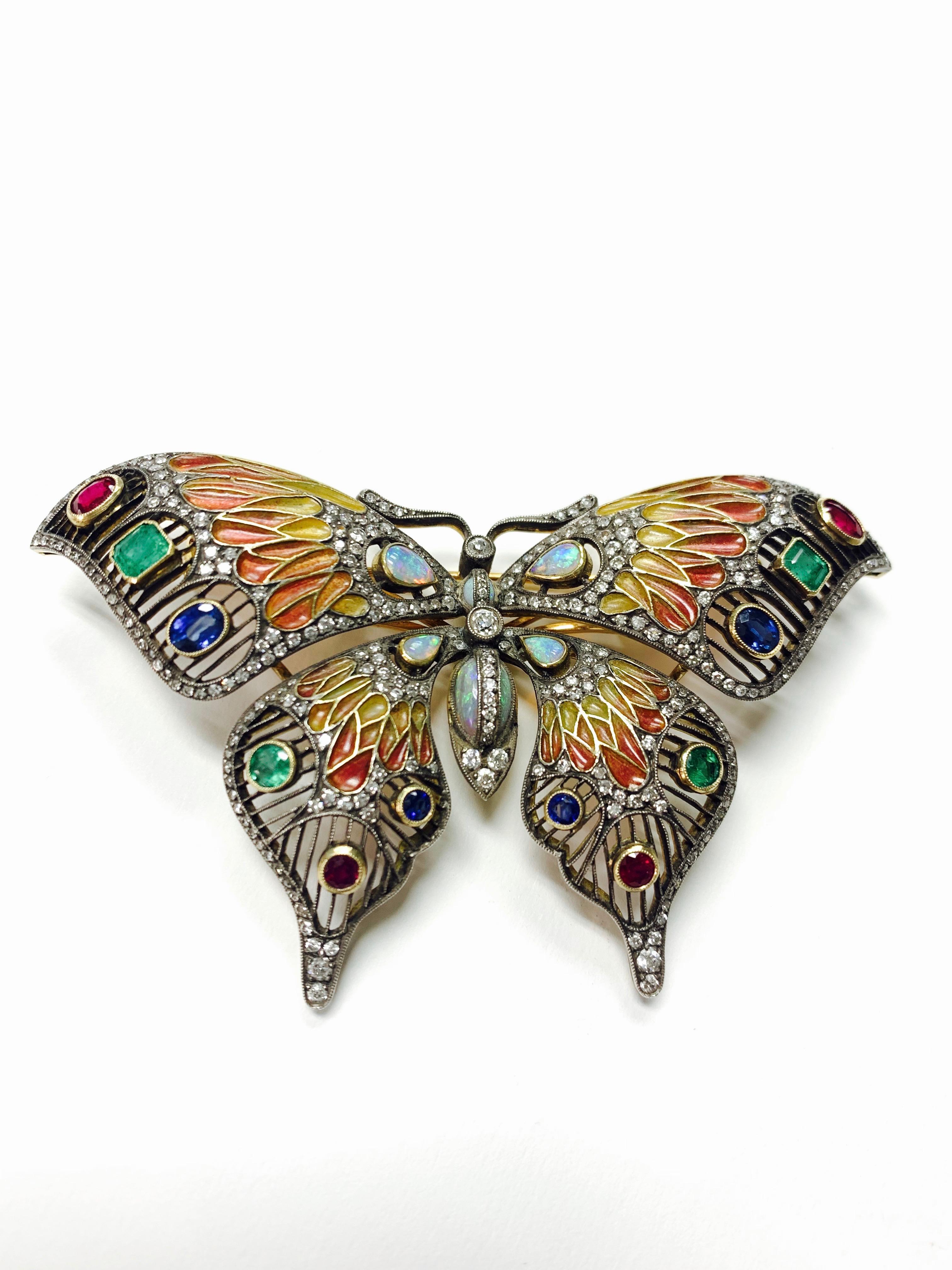 Diamond, opal, emerald, blue sapphire and rubies butterfly broach in 18k and silver. 
The details are as follows : 
Diamond weight : 3.05 carat 
Opal weight : 3.75 carat 
Emerald, Blue sapphire , rubies weight : 4.35 carat 
Metal : 18 K gold and