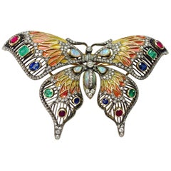 Broche papillon en diamants, opales, émeraudes, saphirs bleus et rubis