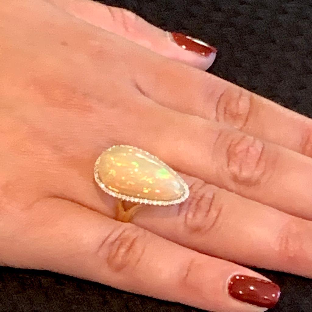 CERTIFIED Price- $5,950 
MAGNIFICENT LADIES FINE QUALITY LARGE OPAL 13.85 TCW  14KT RING

This sophisticated and glamorous ring is a Certified Authentic Fiery Multicolored Opal and Diamond ring made with luxurious 14KT Gold Solid Gold with a total