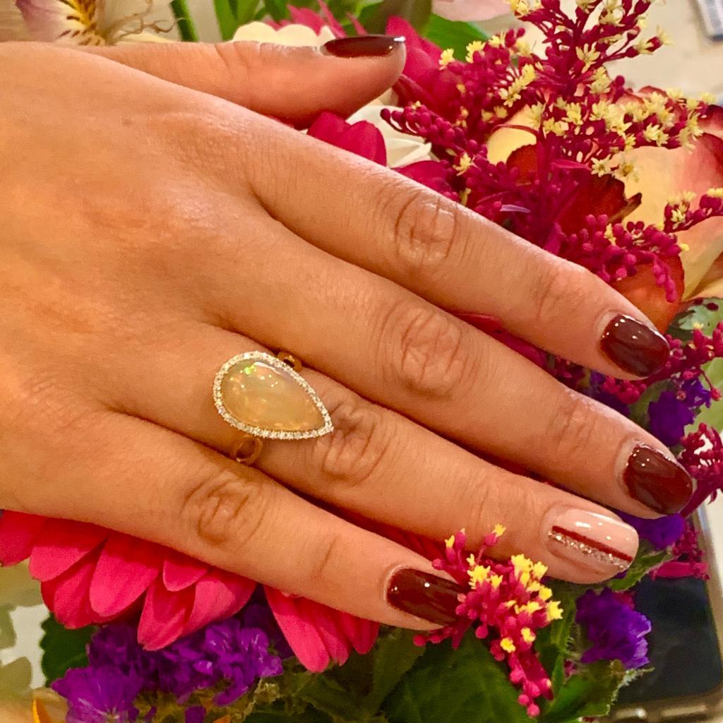 CERTIFIED $3,950 FINE OPAL AND DIAMOND 5.75 TCW 14 KT LADIES RING 
This beautiful ring is a Certified Authentic Opal & Diamond ring made with luxurious 14KT Gold Solid Gold with a total weight of 5.31 grams.
This is a One of a Kind Unique Custom