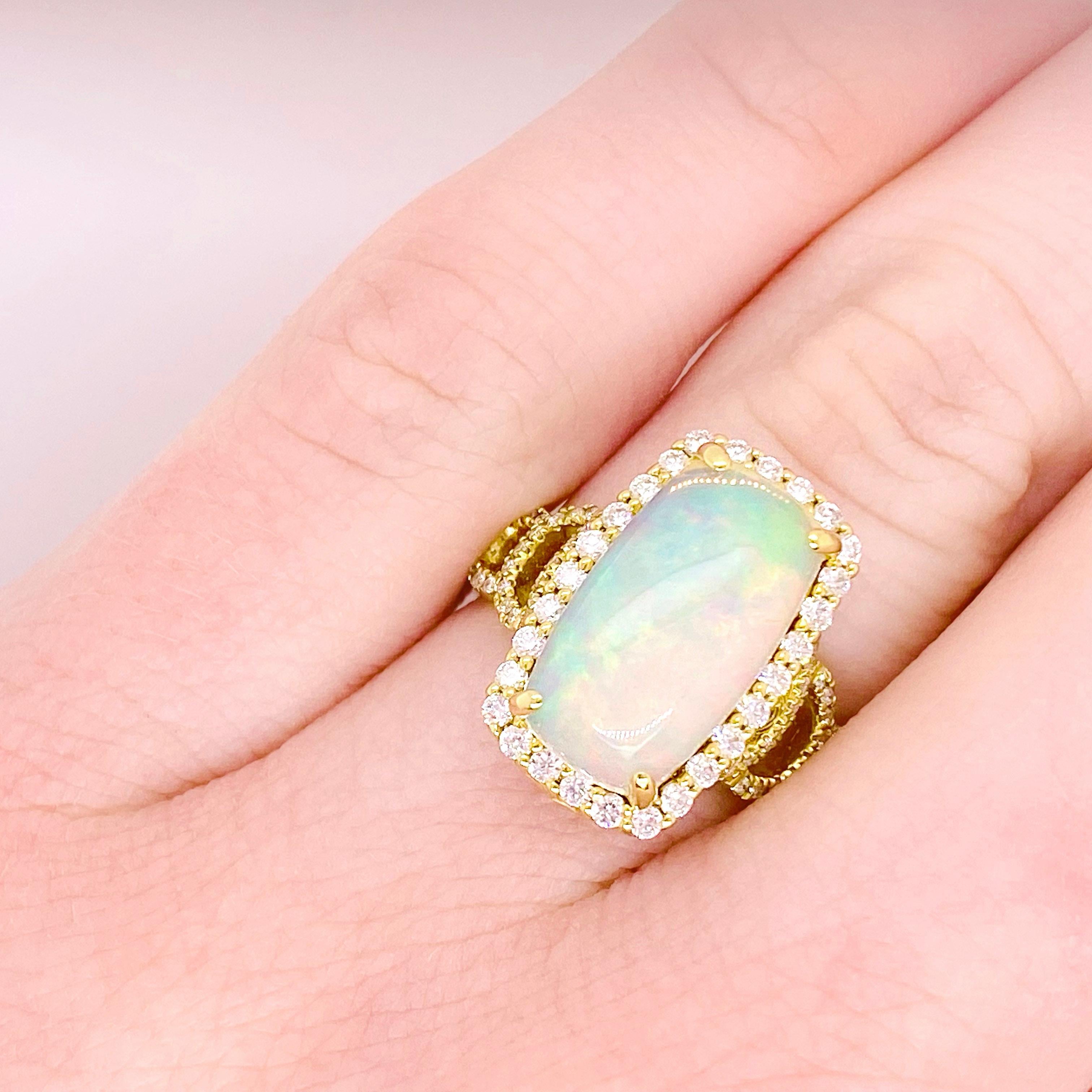 Australian opals can vary from white to fiery and this 3.40 carat cushion cut opal is definitely a very fine specimen! The bright colors that reflect the light are iridescent and all the colors of the rainbow! This ring is a gorgeous design that
