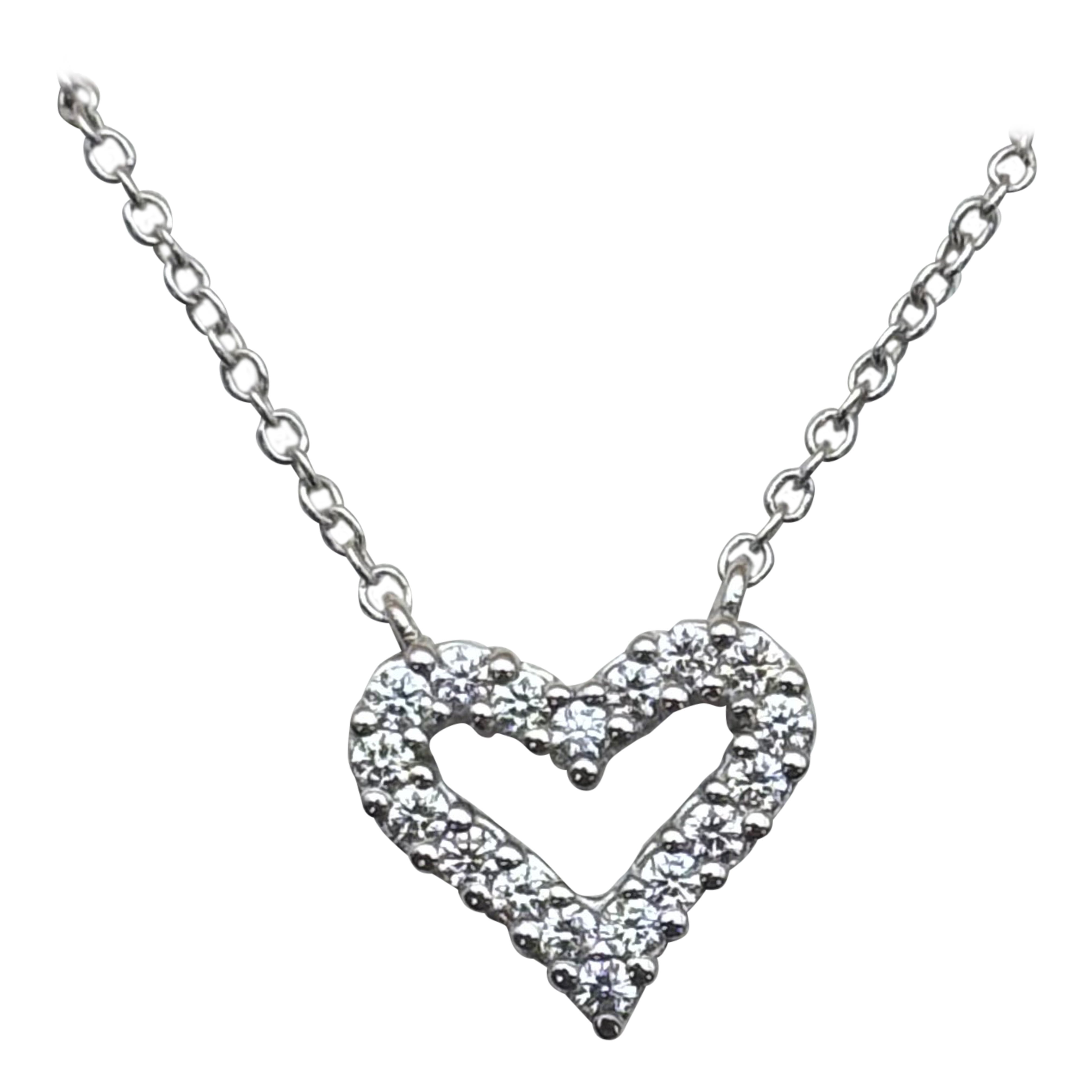 Ciondolo a cuore aperto con diamante in vendita